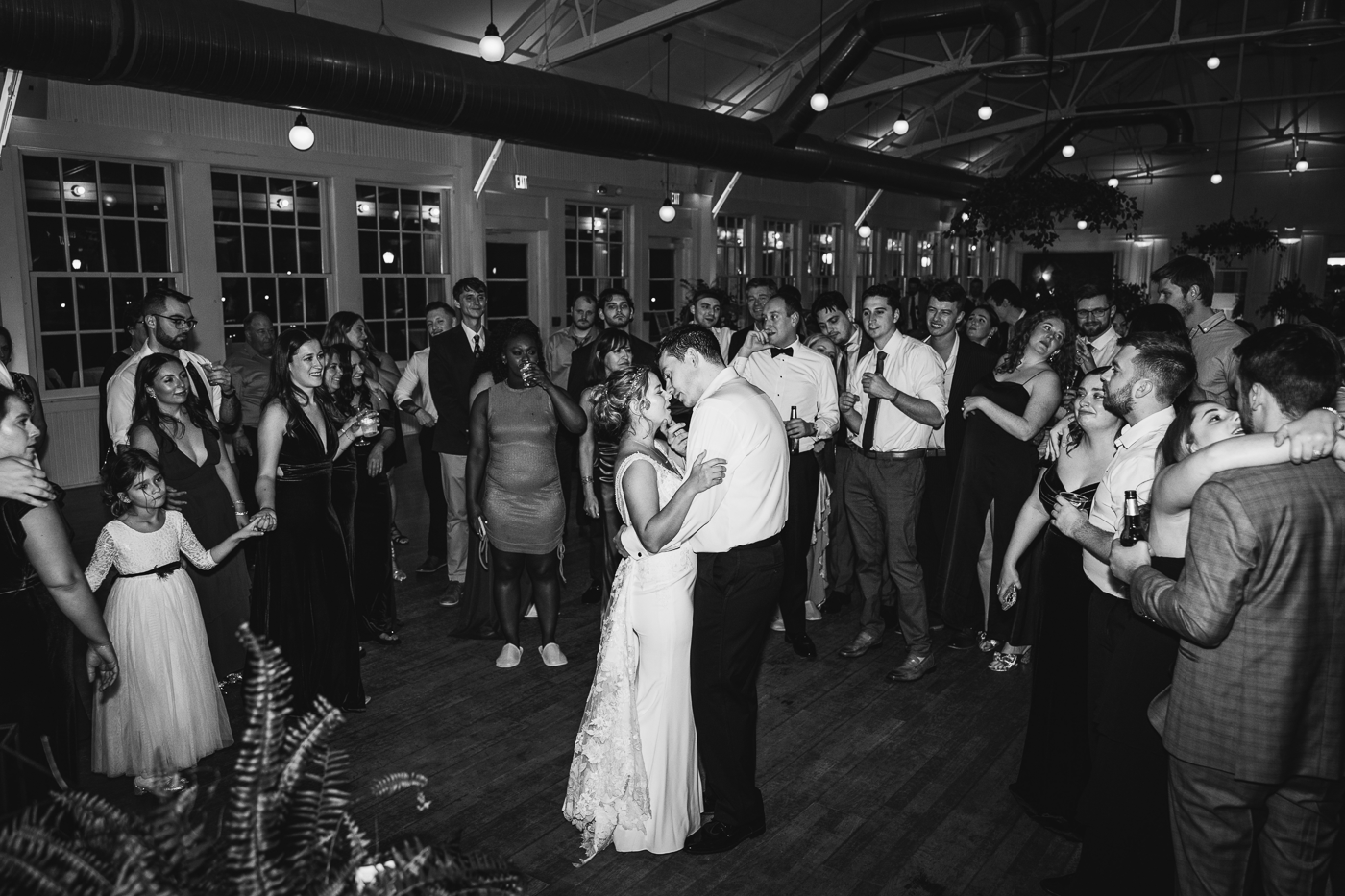 Bride and Groom share an intimate final dance surrounded by their wedding guests
