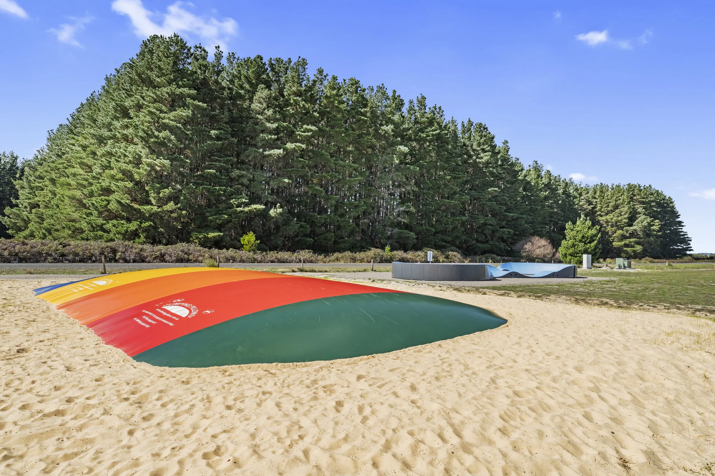 Jumping Pillow and Pump Track with a gorgeous backdrop of the pines