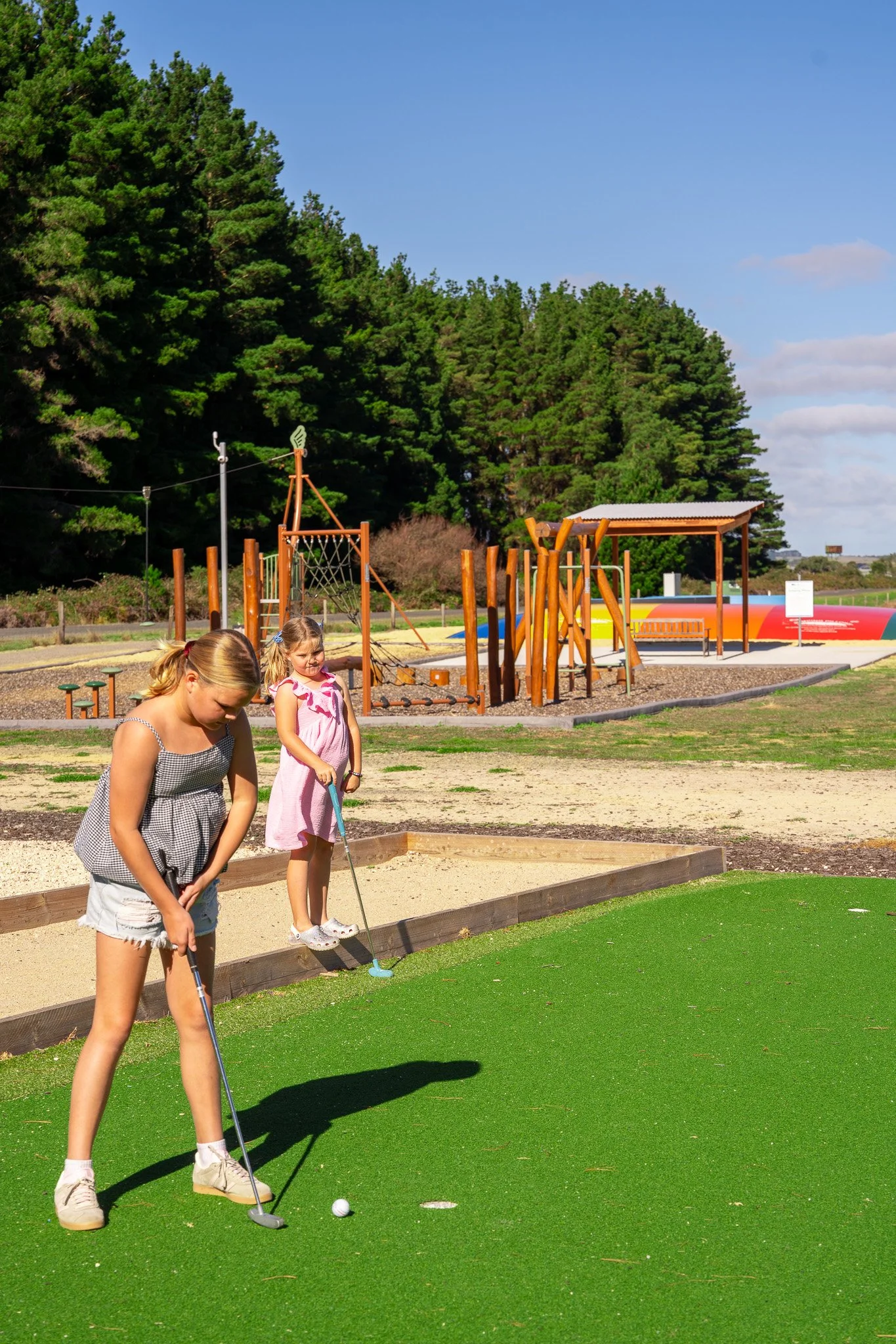 Outdoor play area featuring giant chess, bocce and putting green.