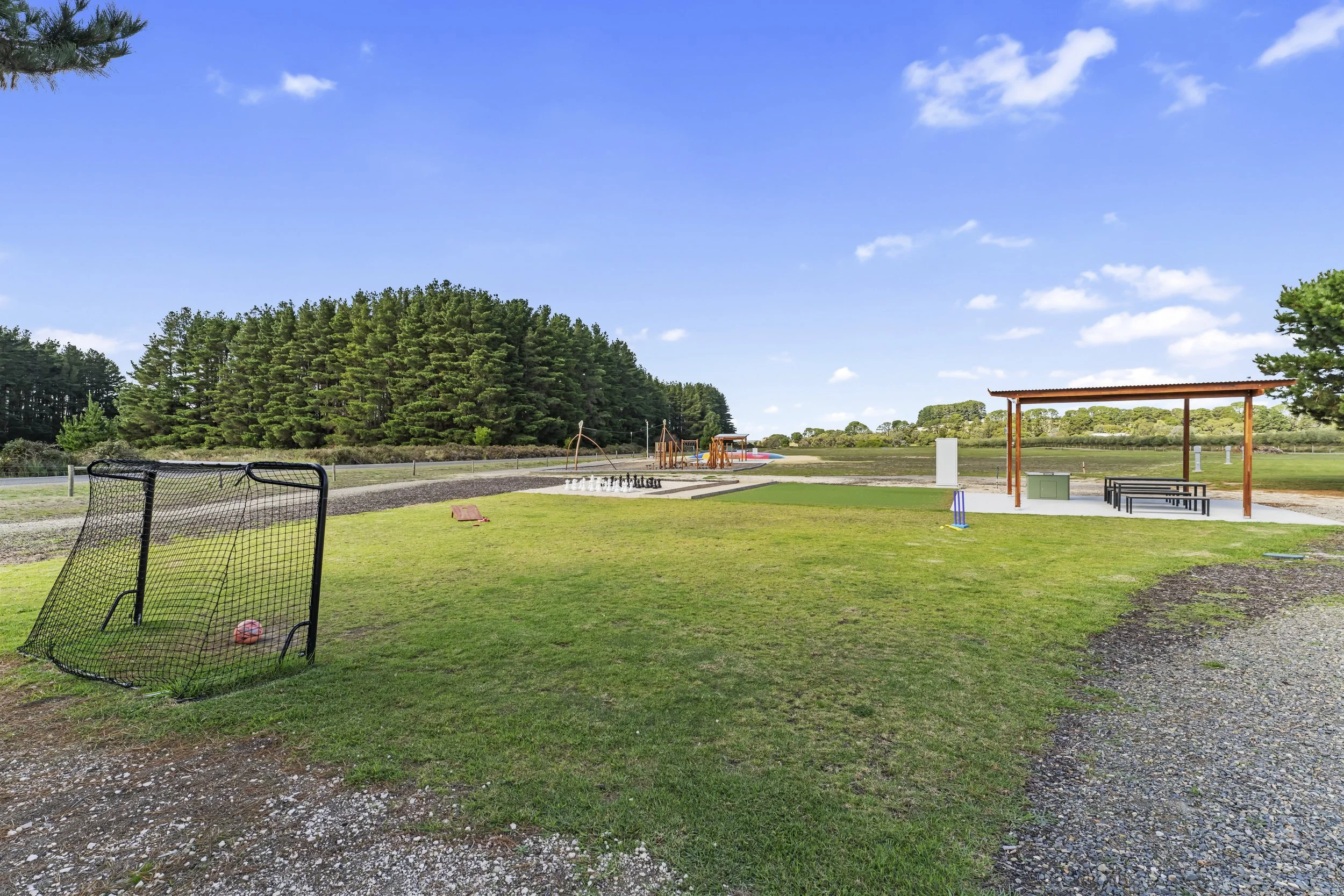 Outdoor play area with soccer goals and BBQ shelter