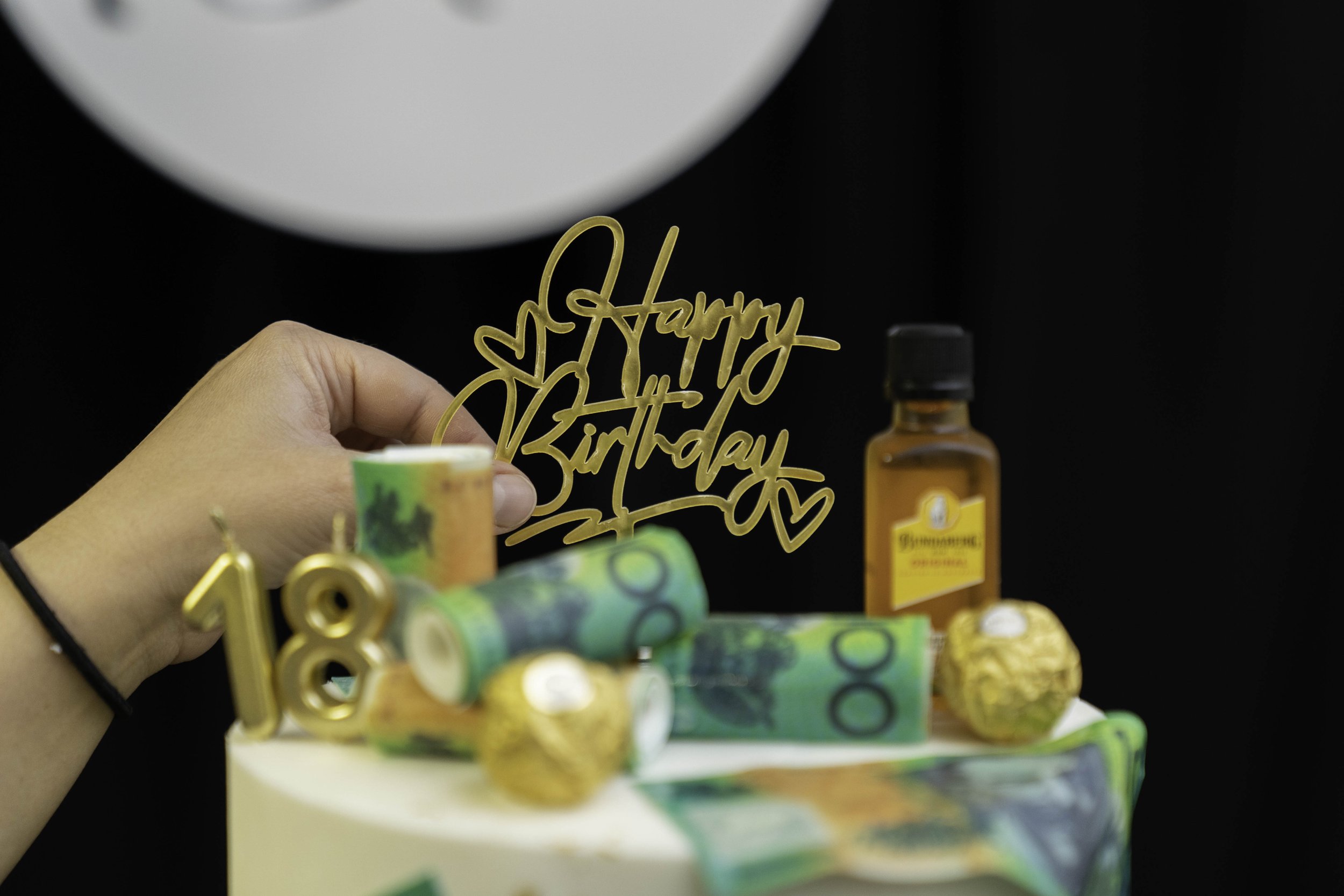 holding birthday decoration