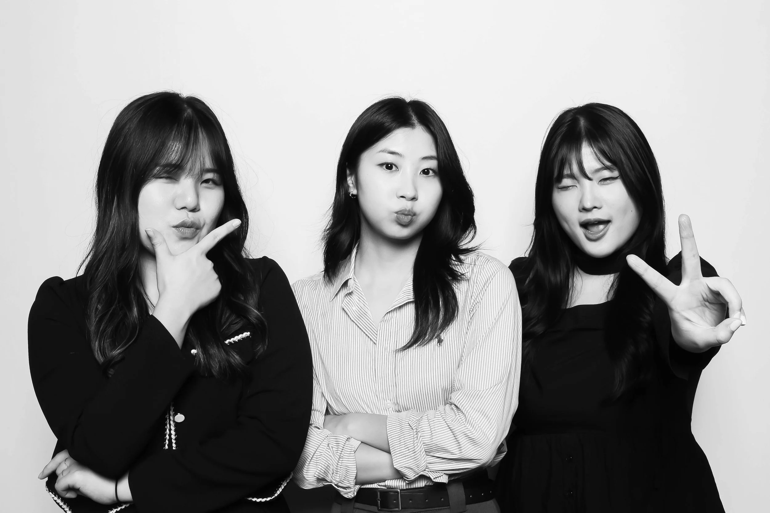 Girls posing in front of photo booth