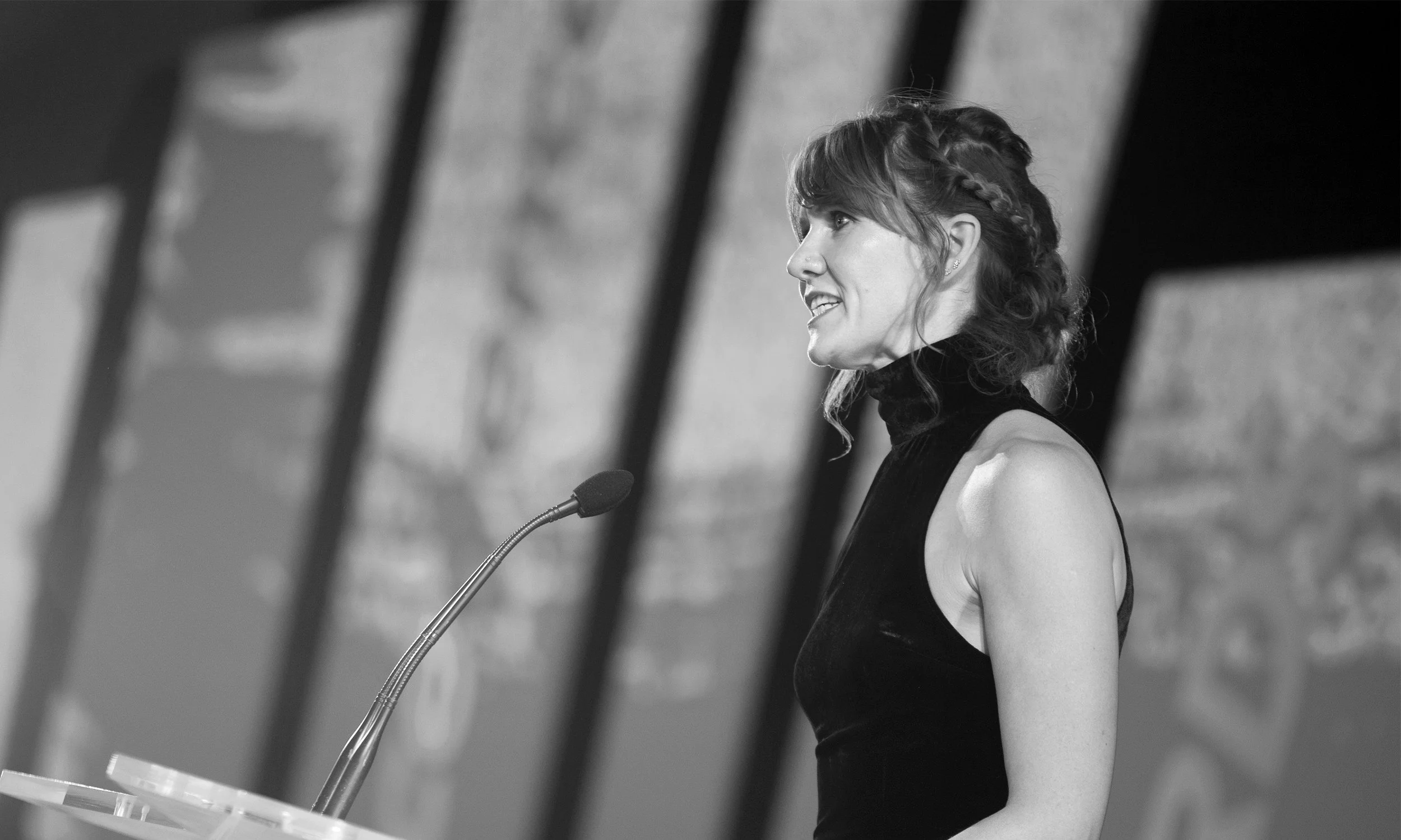 Photo of Sarah Waddington giving a lecture on PR and Marketing.