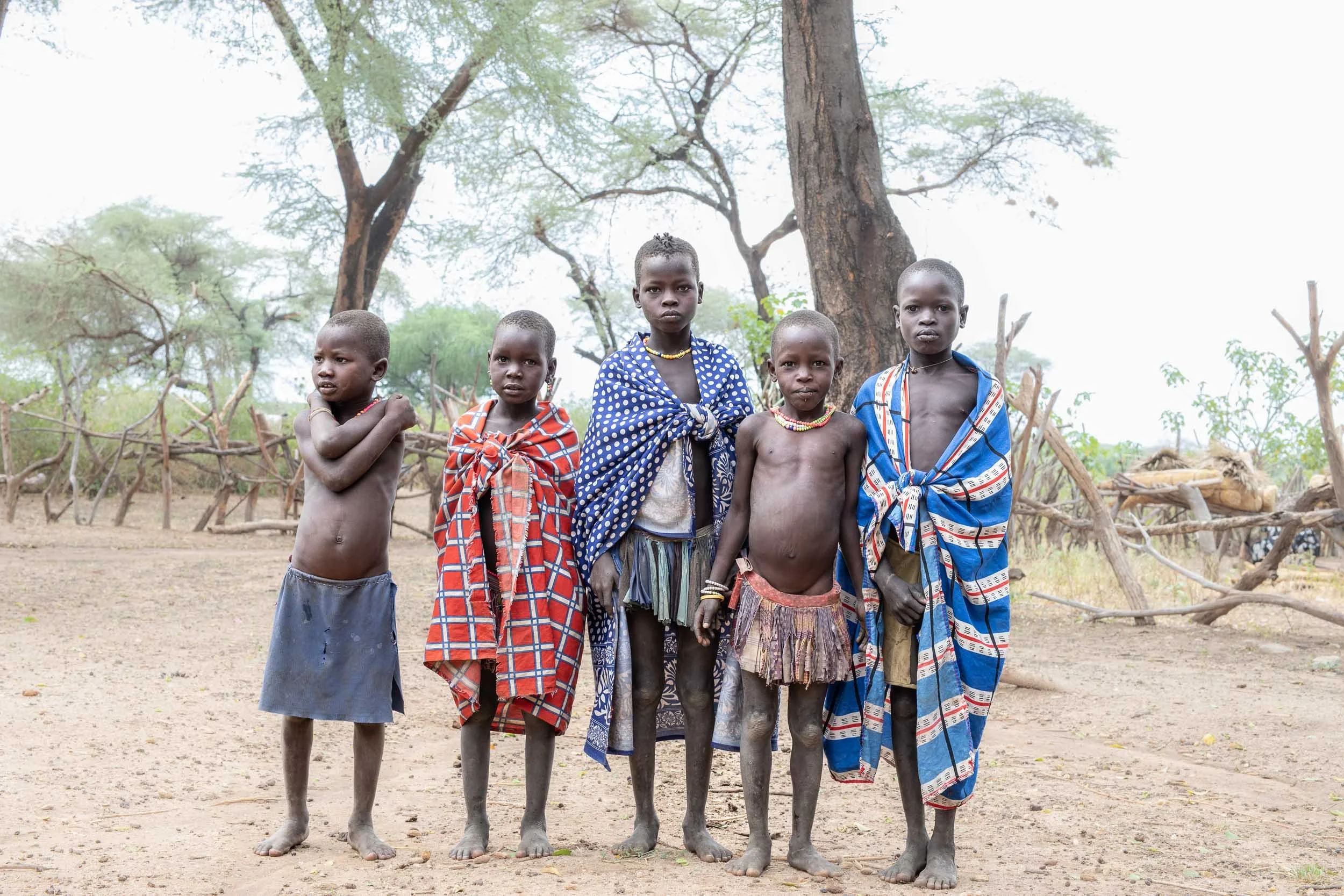 Laarim children standing in a row, South Sudan