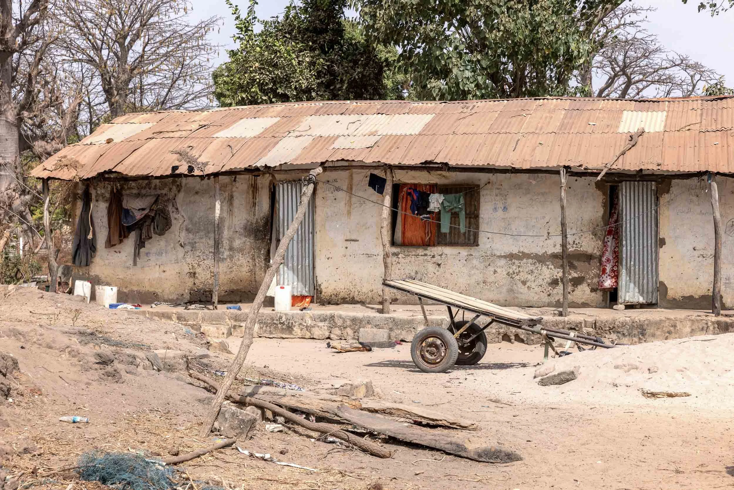 Single story house with corrugated iron roof, Gambia
