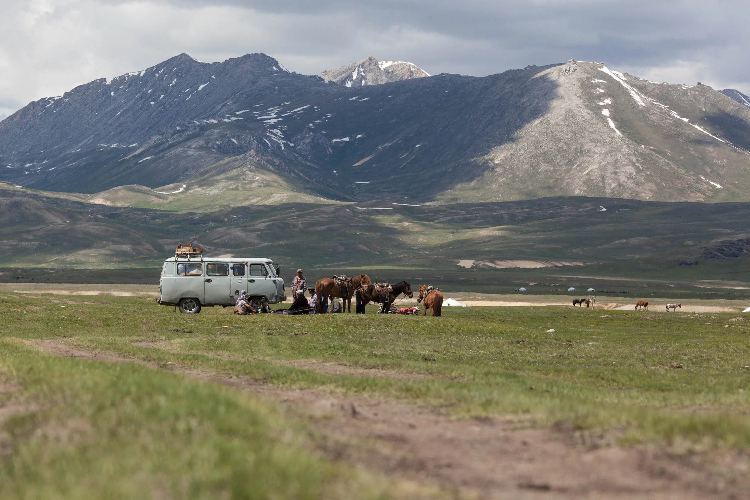 Purgon van and horseman on steppe, Mongolia
