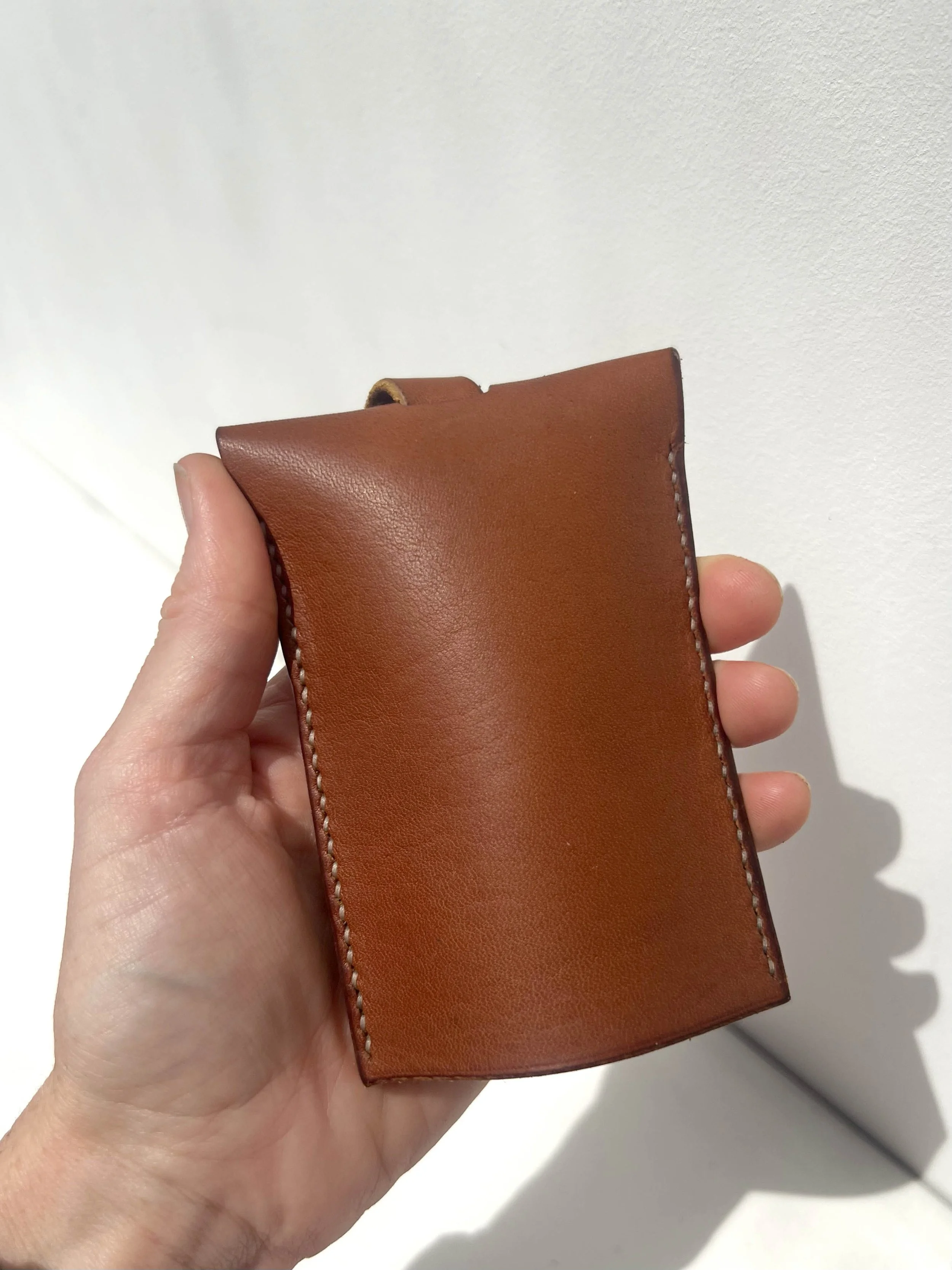 Mauro keycase in amber in the hand.jpg