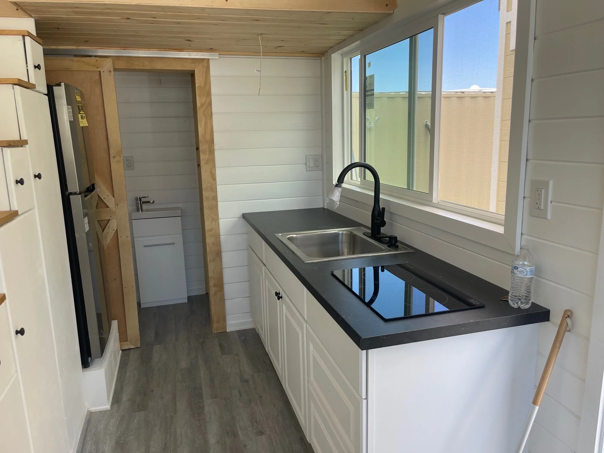 Kitchen- looking toward bathroom (barndoor)