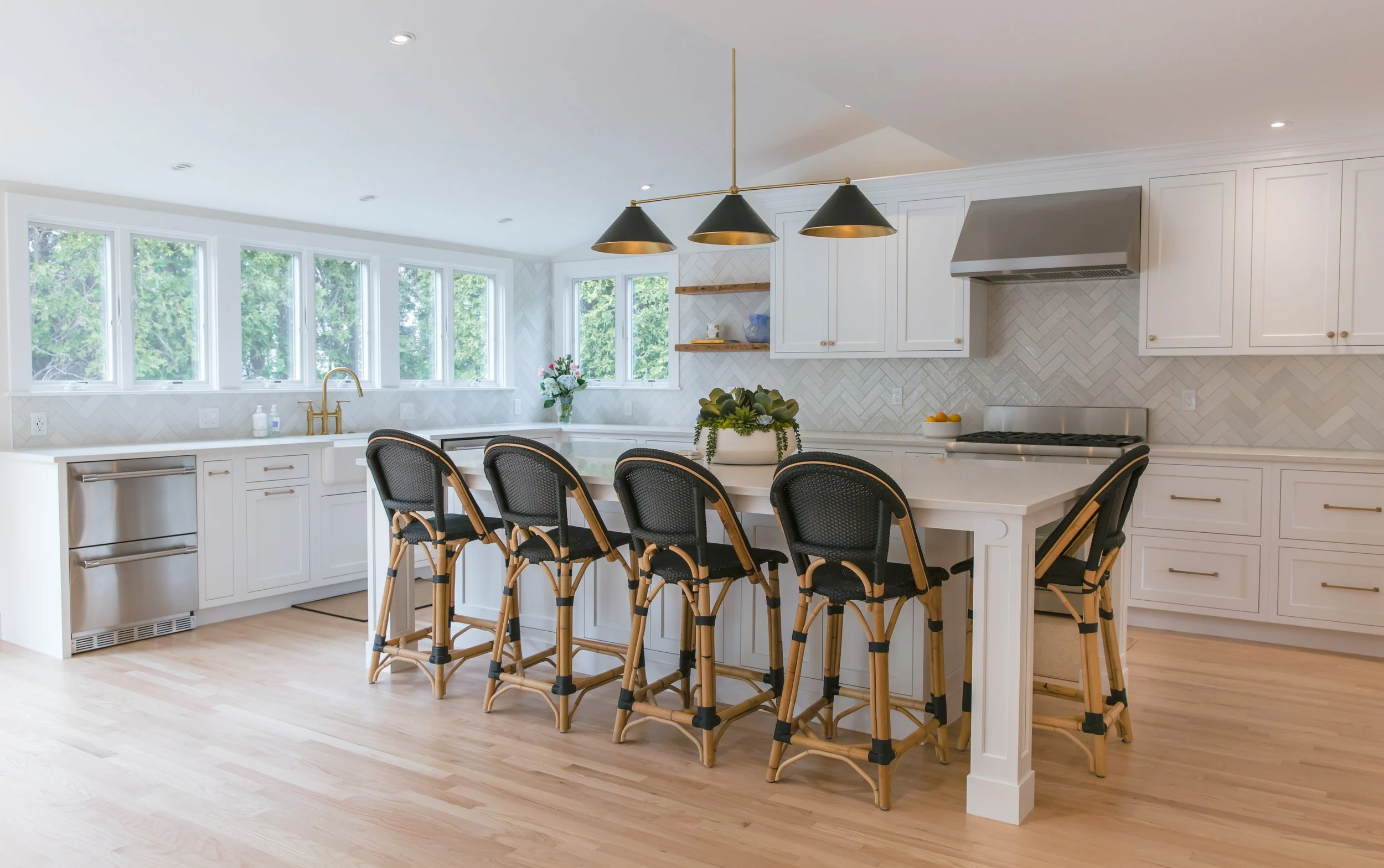 white kitchen cabinets and stools