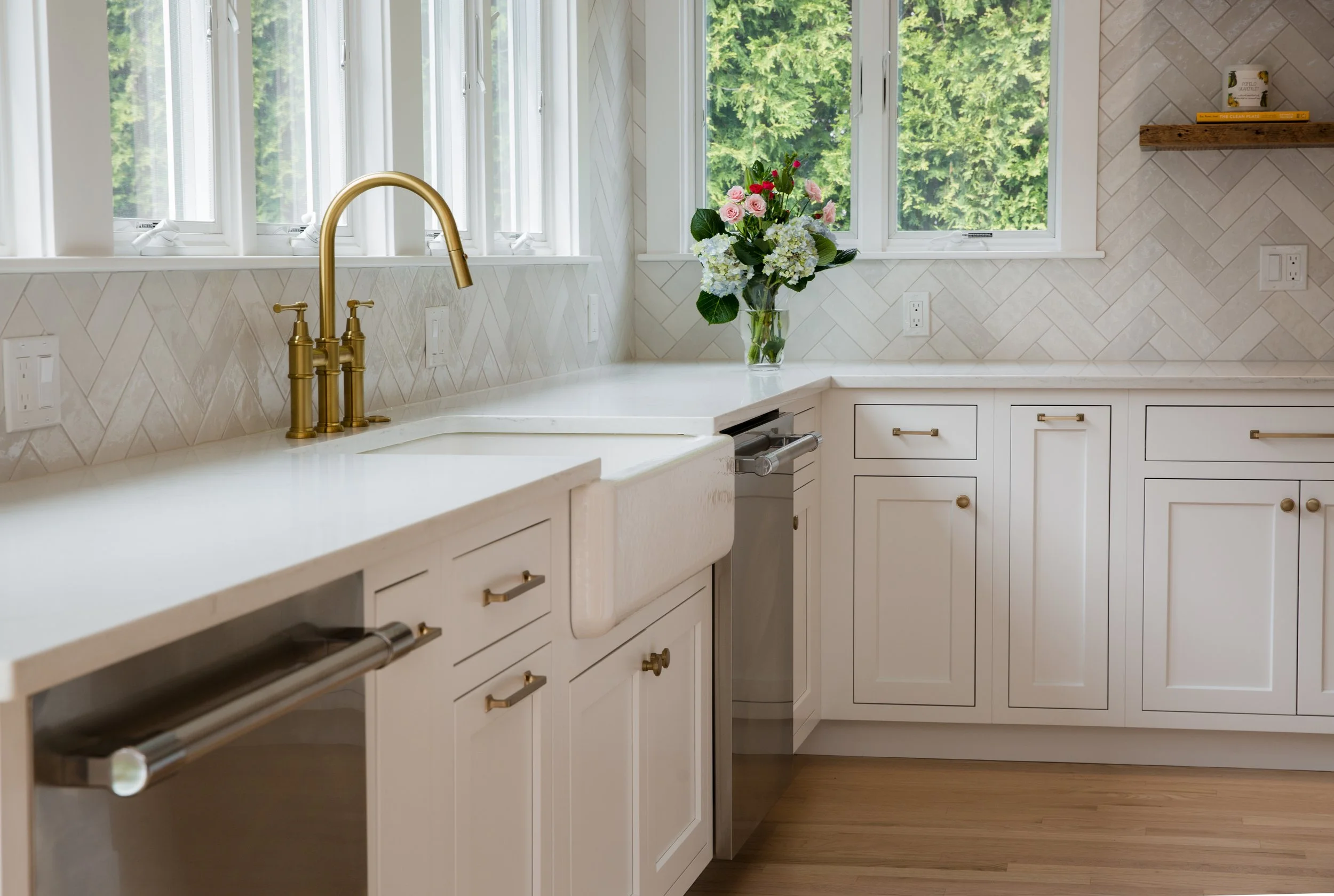 white cabinets, brass faucet, herringbone tile
