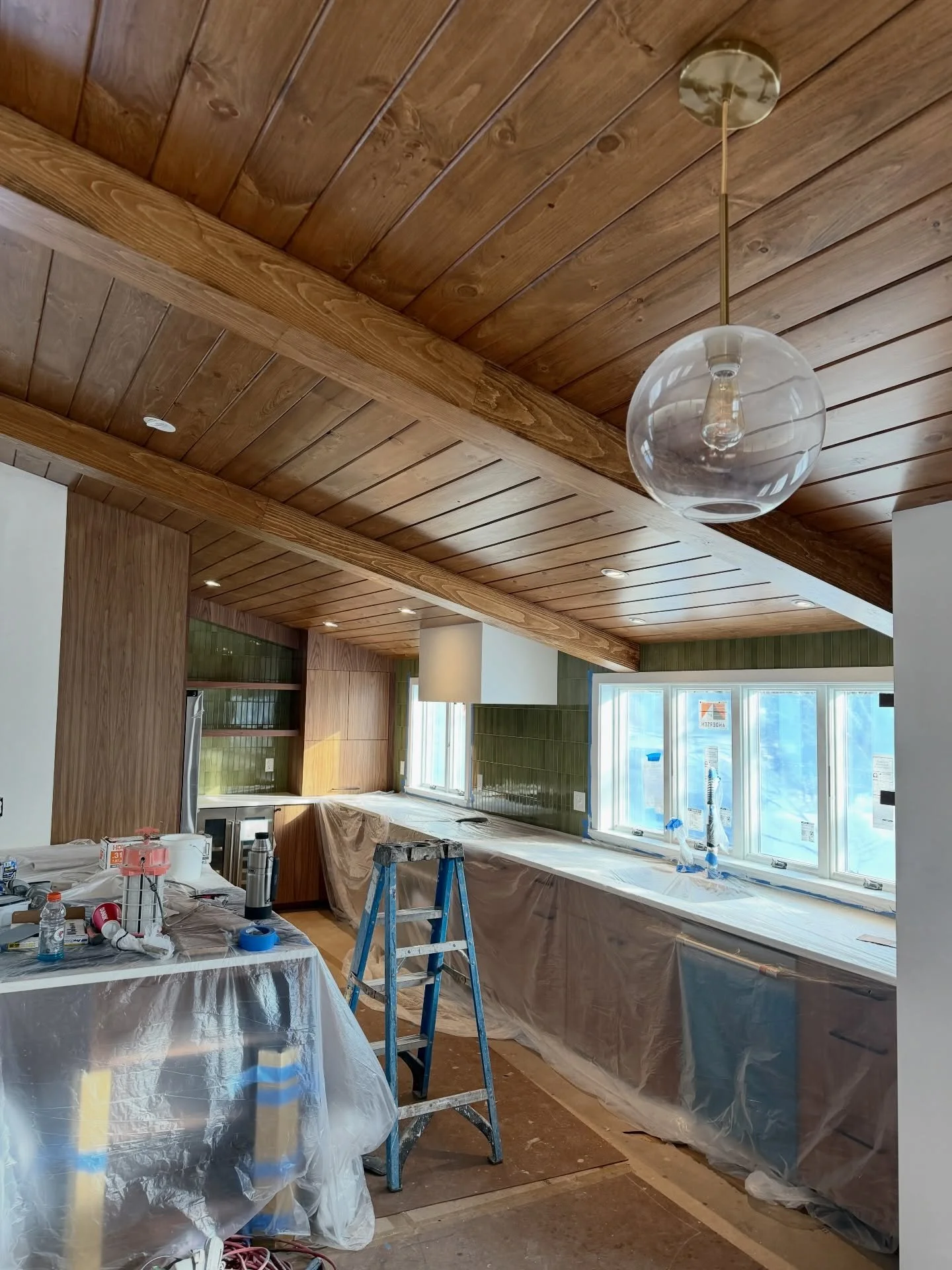 We&rsquo;re at the finish line! This kitchen and living room are almost move-in ready, with final paint and punch list details underway. Loving every detail - the ceiling, tile, cabinets, natural light, and perfect flow. Great job team!
