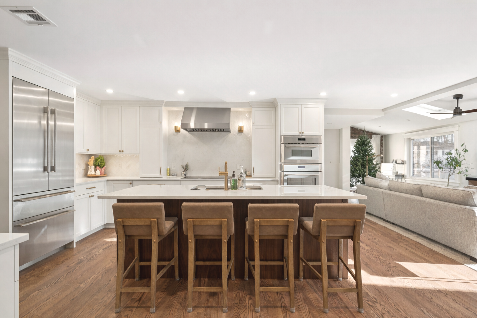 white kitchen cabinets and wooden stools