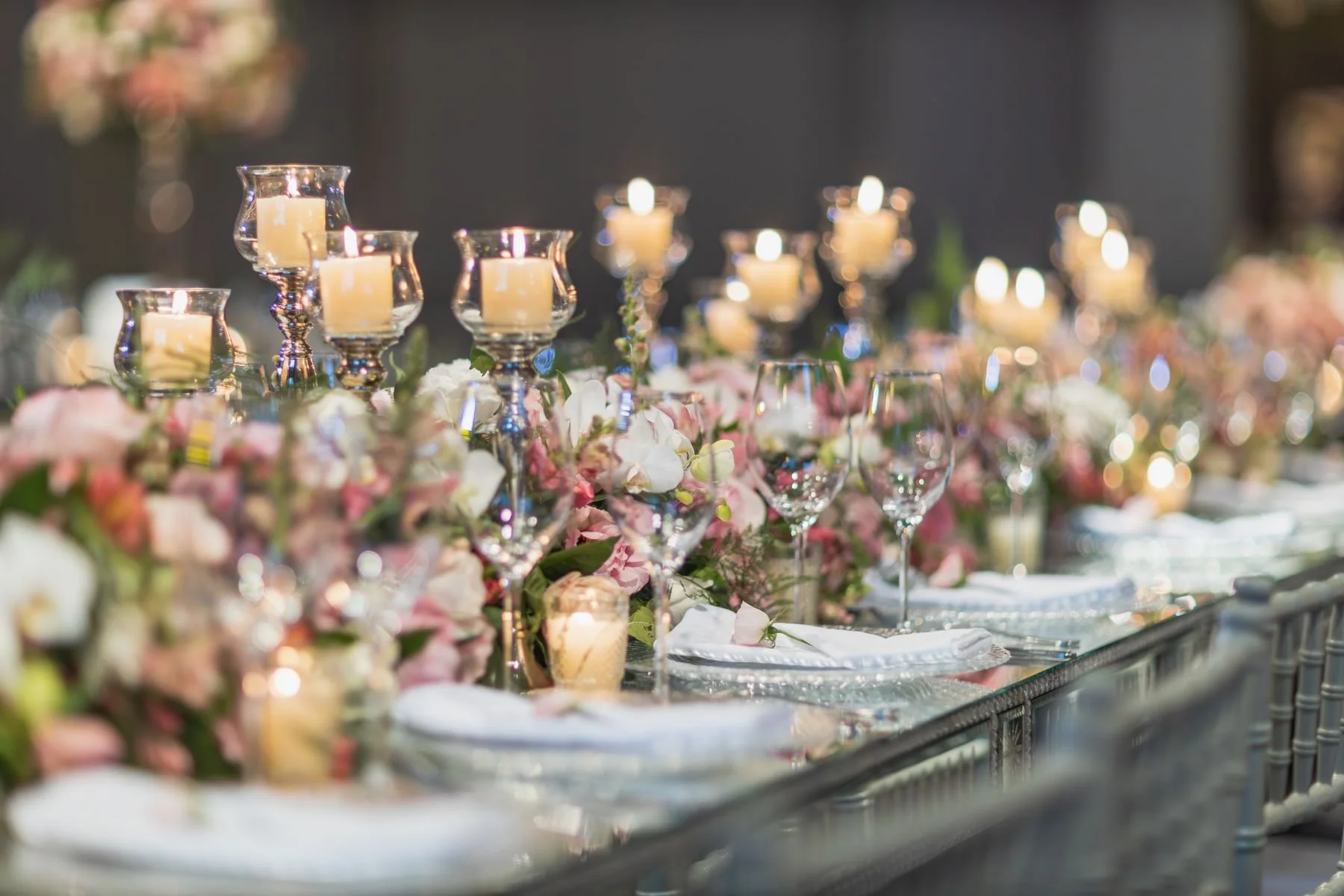 Elegant Christmas wedding reception with emerald, ivory, and candlelight decor
