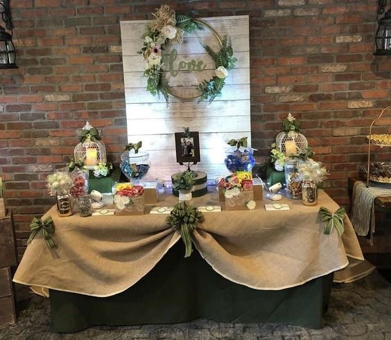 A burlap tablecloth makes the food table instantly rustic. Photo Credit: Catch My Party