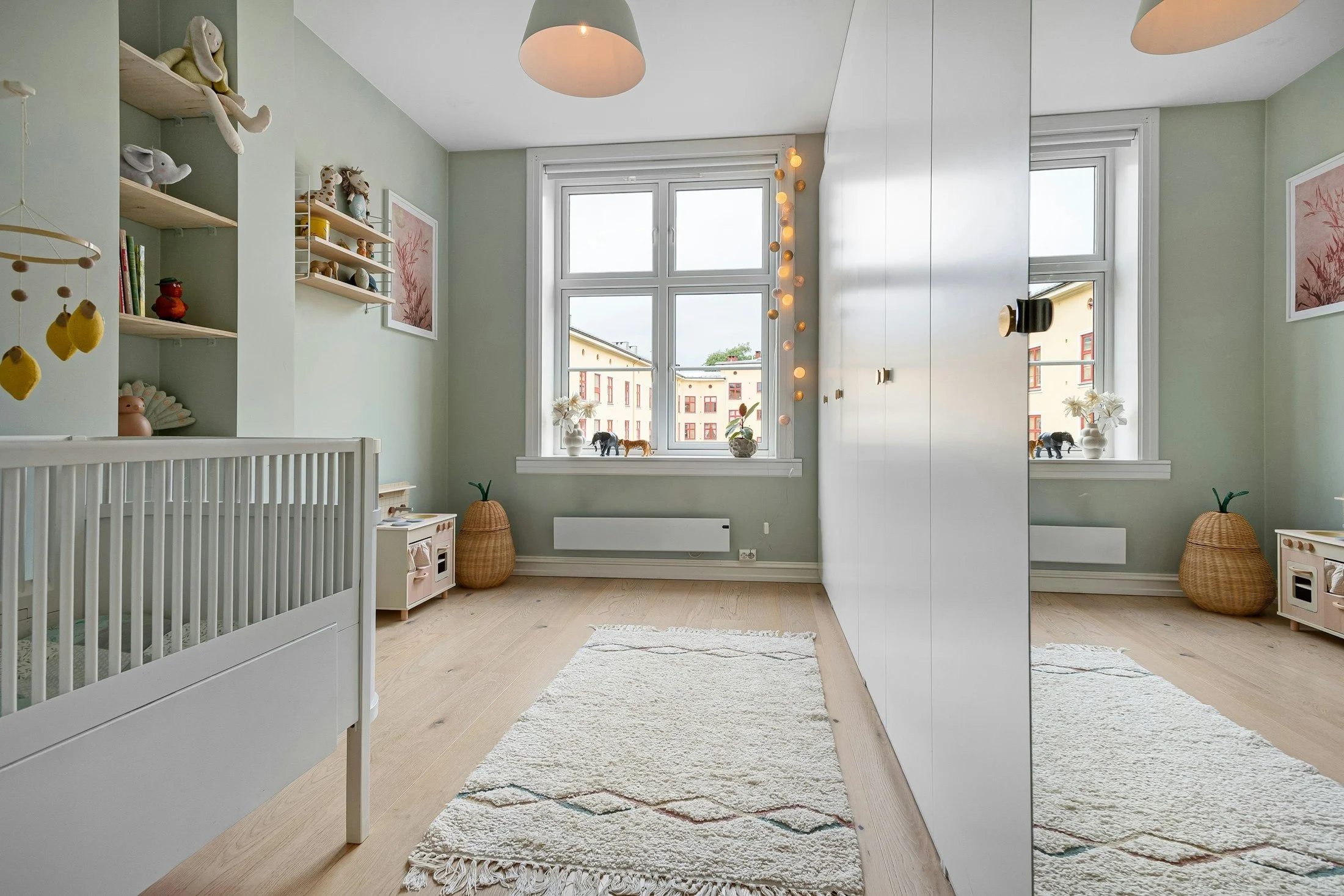 Bright nursery with a white crib for the Huggies family giveaway