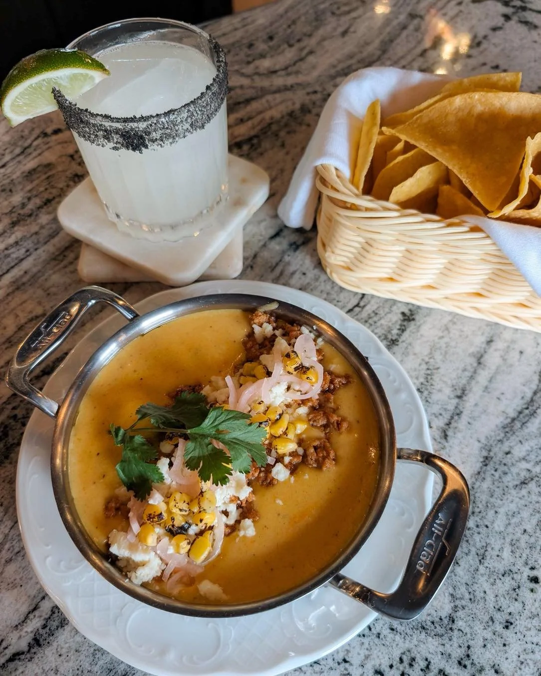 We're not sure one could ever go wrong with a classic margarita and a salty rim. 🍋&zwj;🟩 Do yourself a favor and order the torched corn Peruvian Queso during happy hour while your at it. 🌽✨
