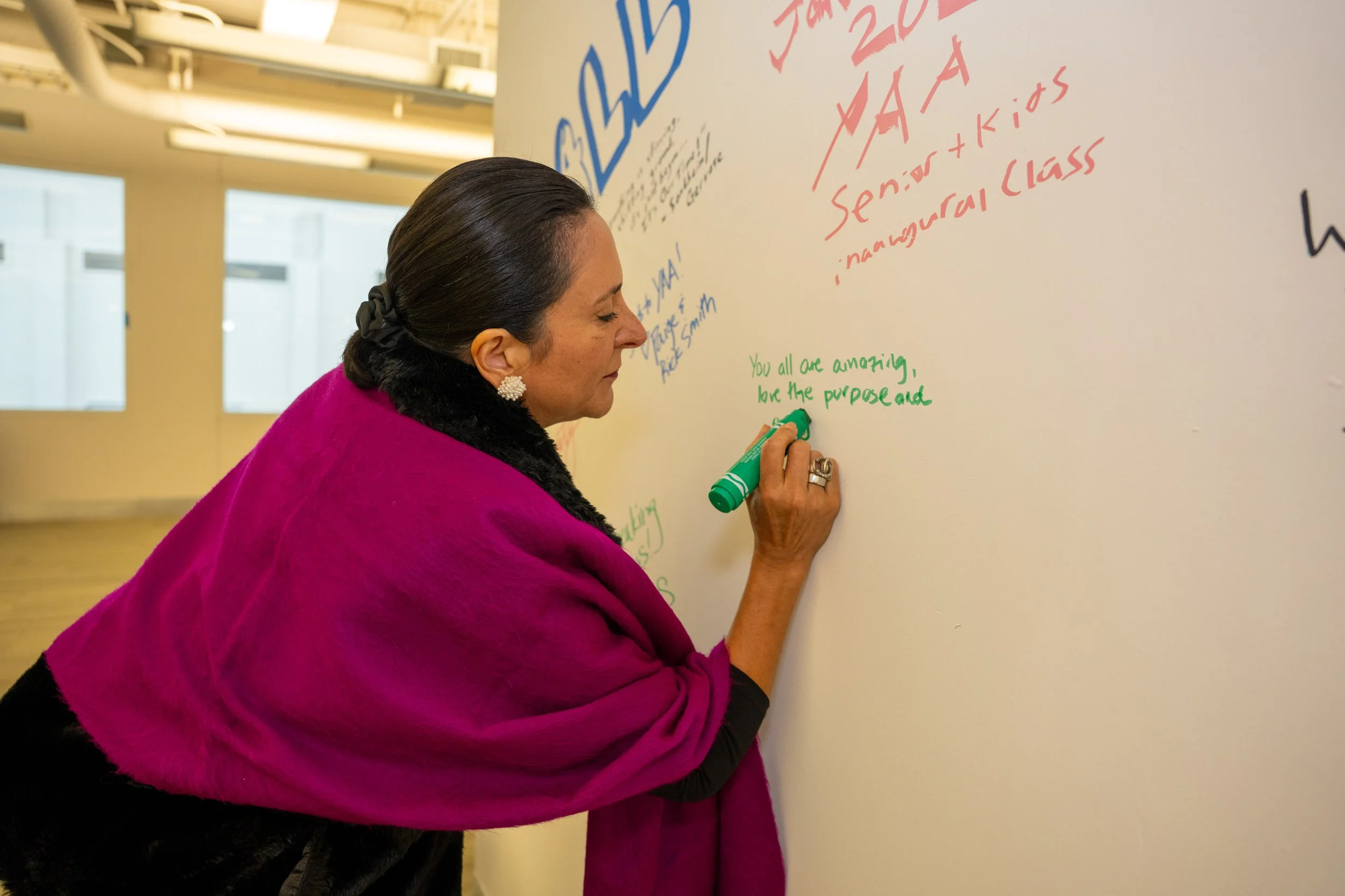 MoCo Chamber of Commerce Executive Director, Angela Franco leaves a message for the future on the Wall of Dreams