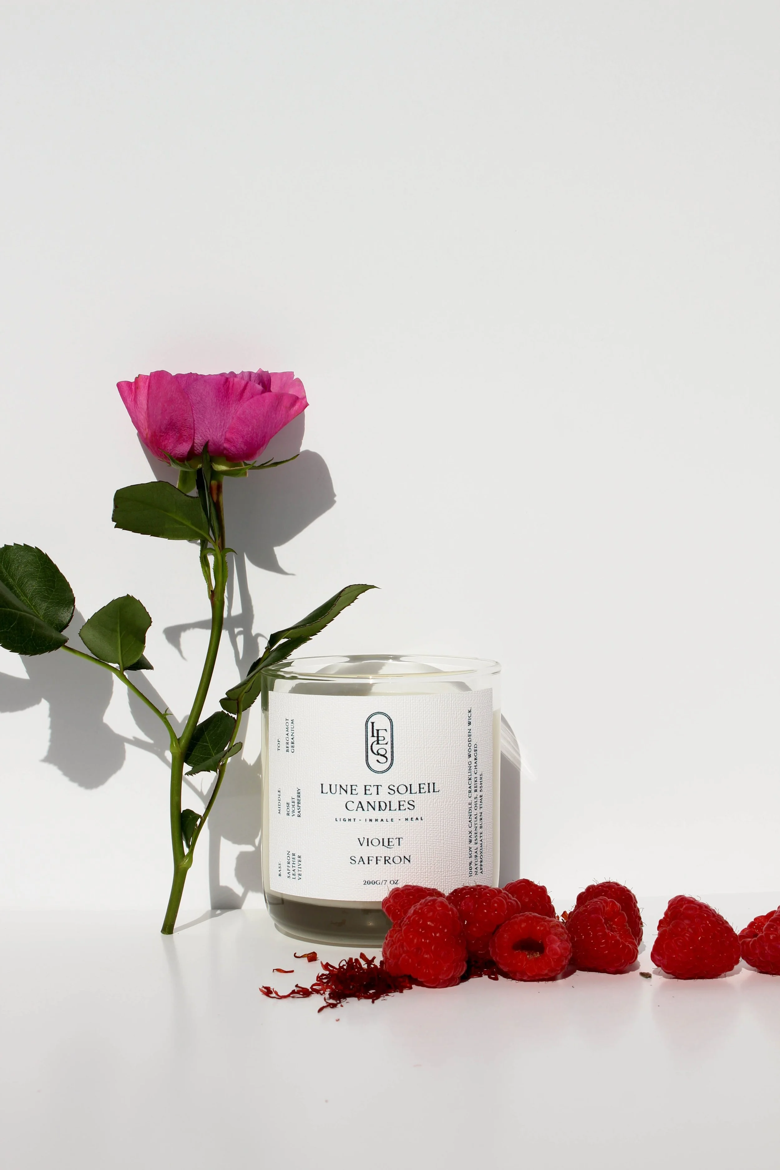 Library soy wax candle styled with raspberries and a rose by Lune et Soleil