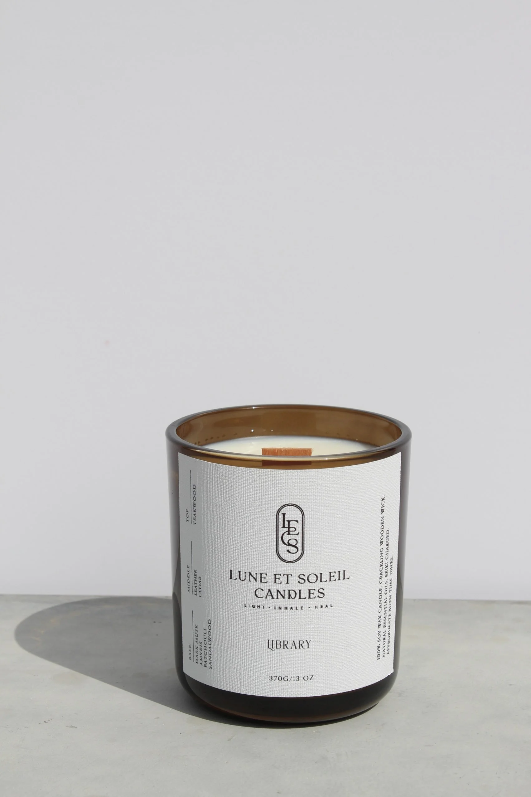 Library soy wax candle in a translucent brown vessel by Lune et Soleil
