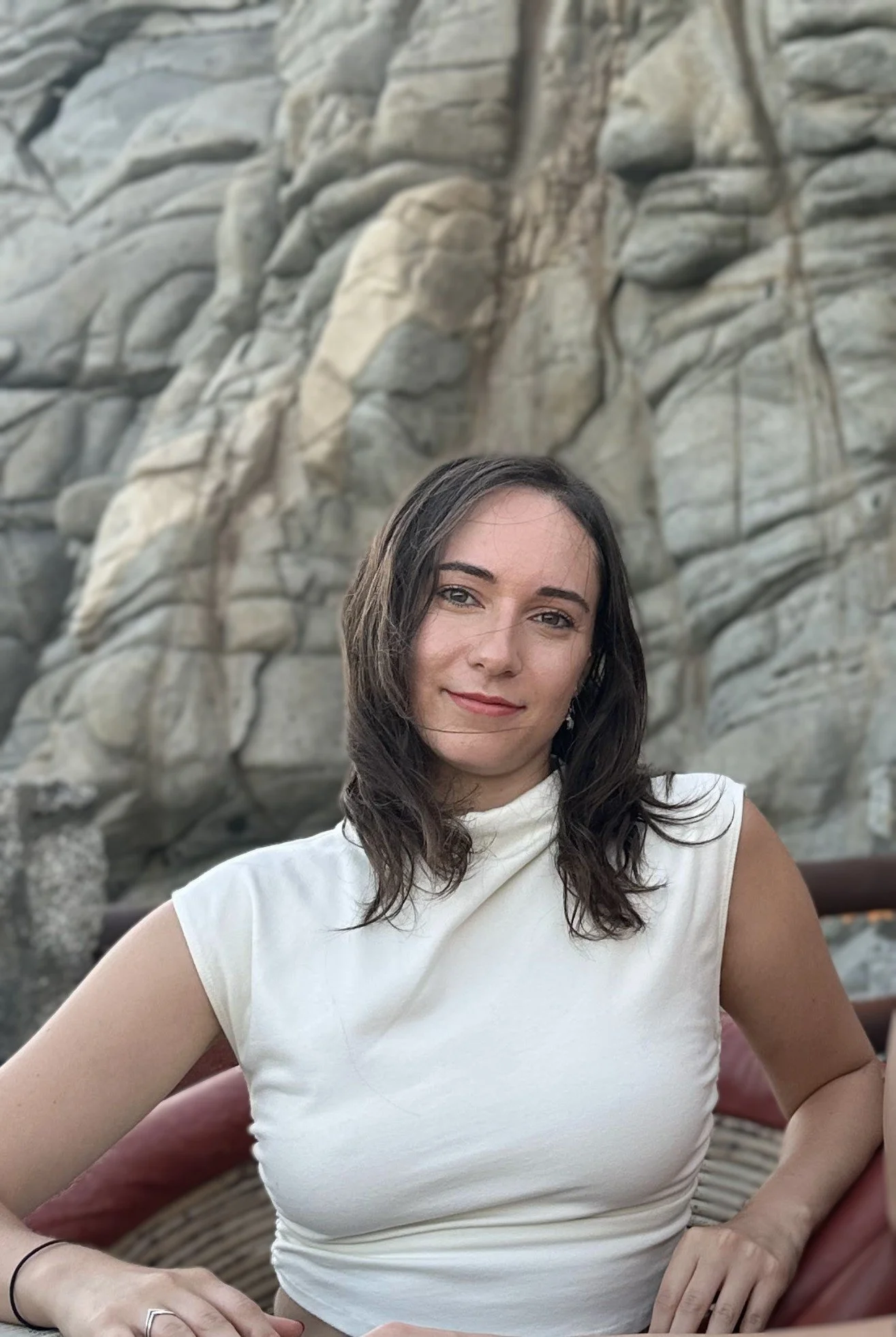 Image of Lauren with large rock formation in background