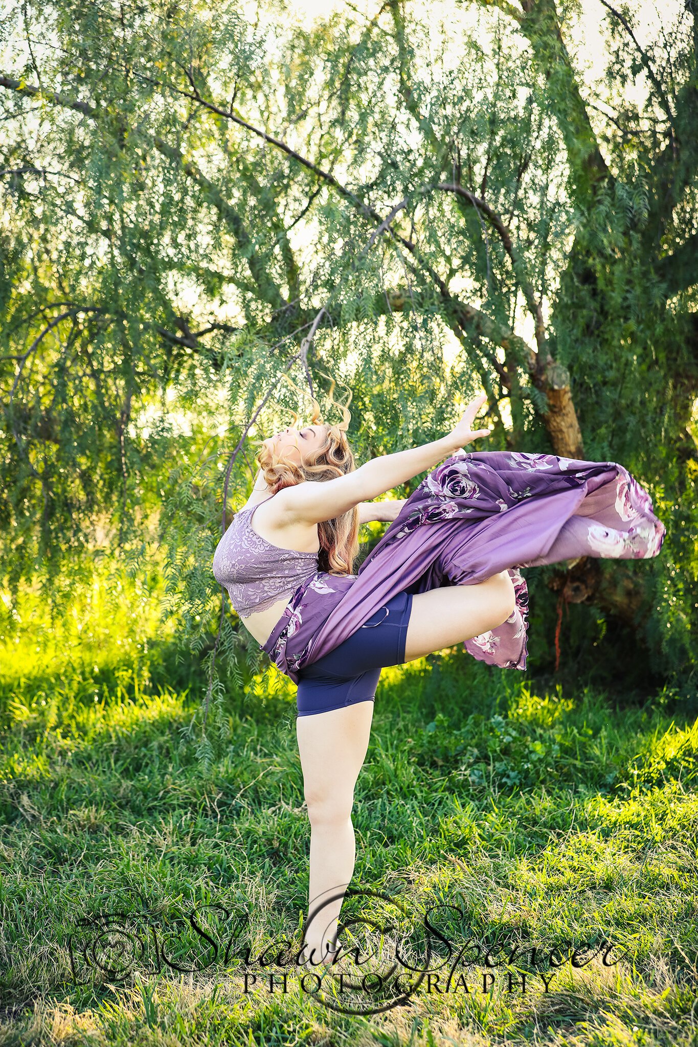  senior girl wearing dance outfit in a pasture 