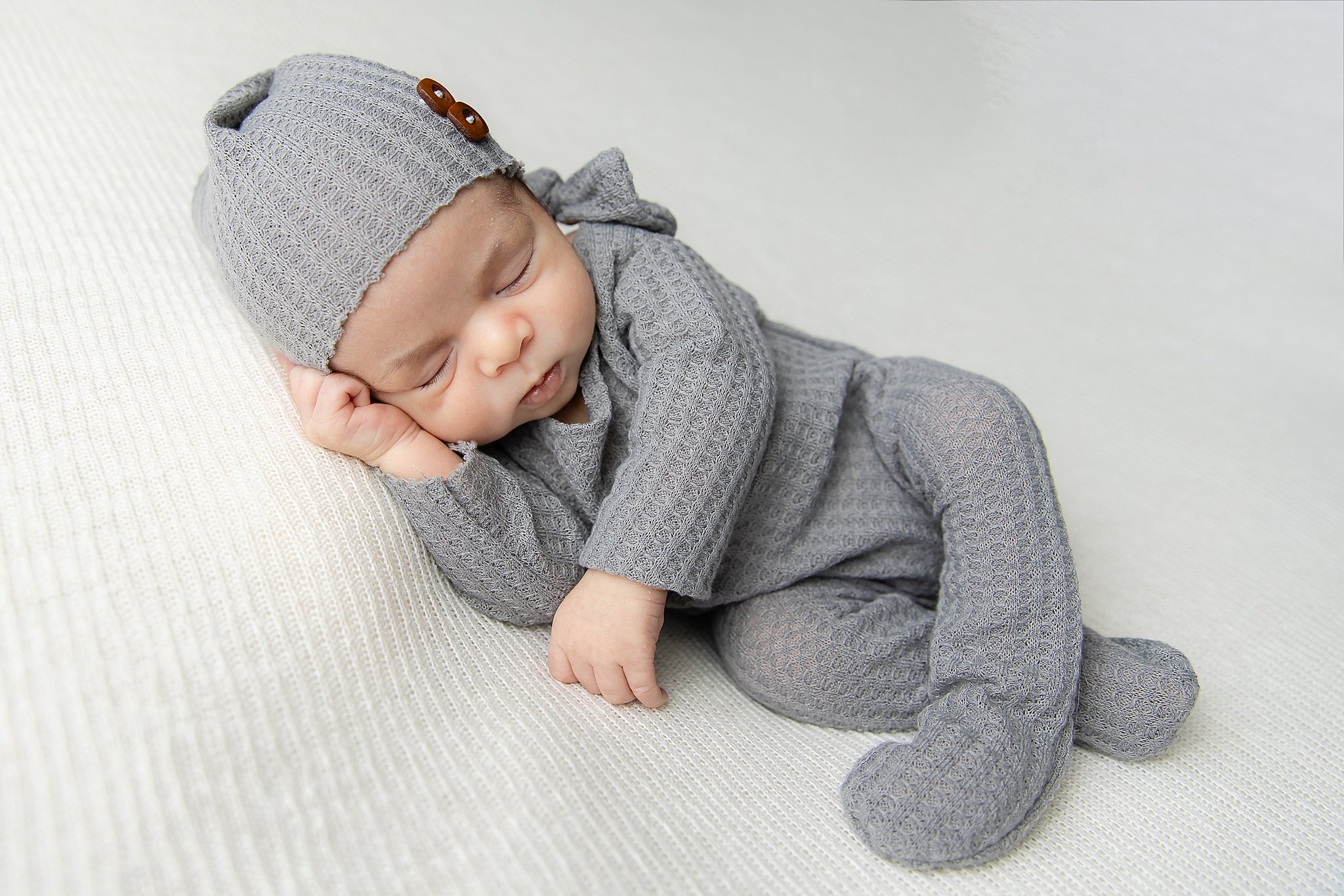 &quot;Capturing the essence of newborn dreams where every yawn and stretch is a tiny masterpiece.&quot;
