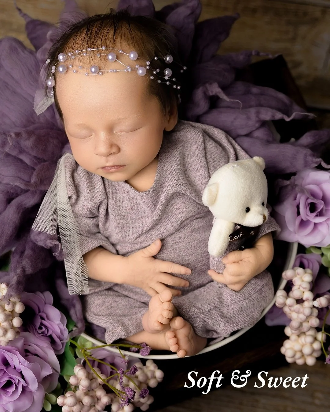 Soft &amp; Sweet

I always love when soft textures and floral tones come together so naturally in a newborn setup.

This beautiful purple setup had such a calm and delicate feel to it, and this sweet baby girl slept right through it all. The tiny ted