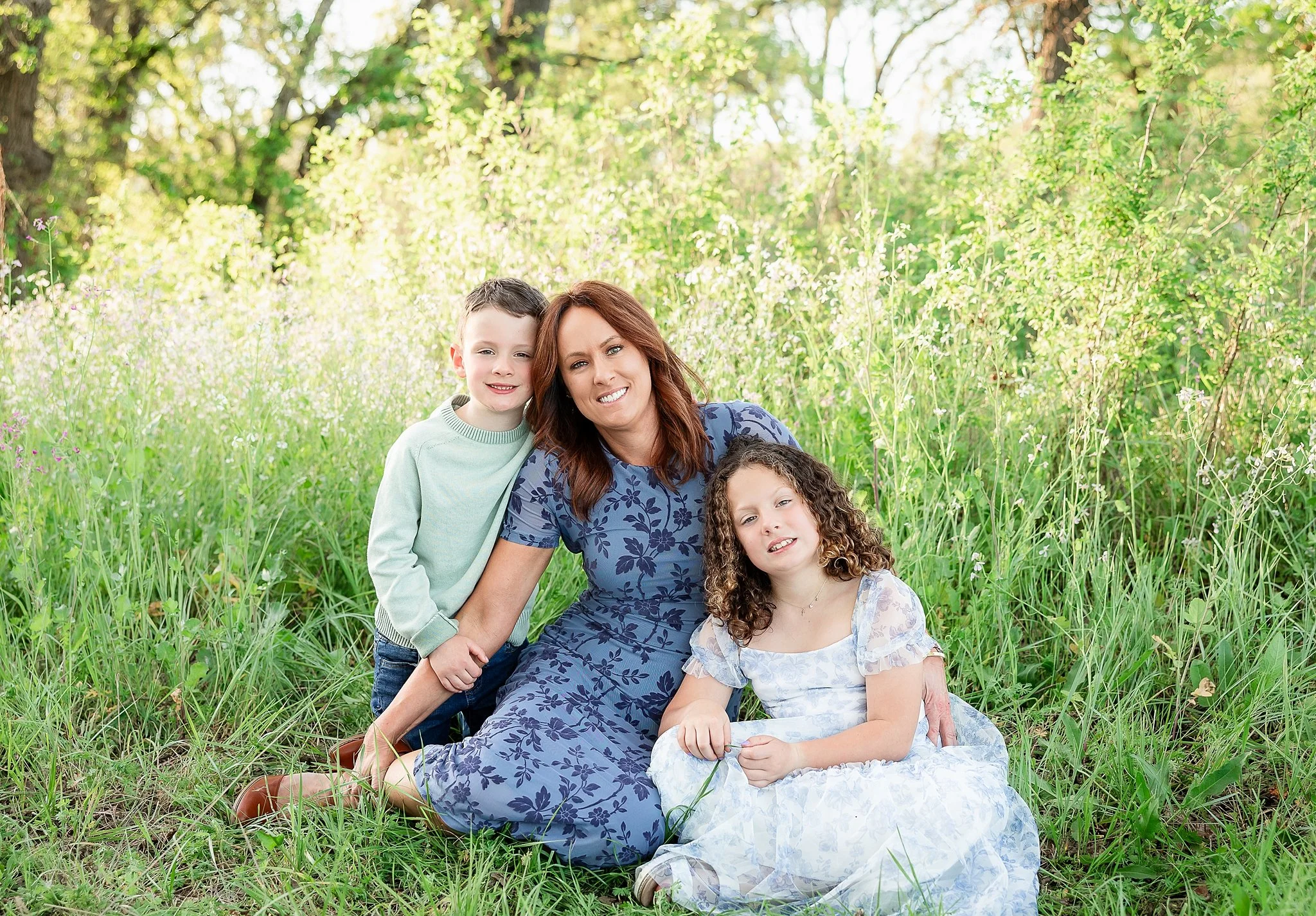 Mom with her son and daughter during an outdoor family portrait session in Elk Grove