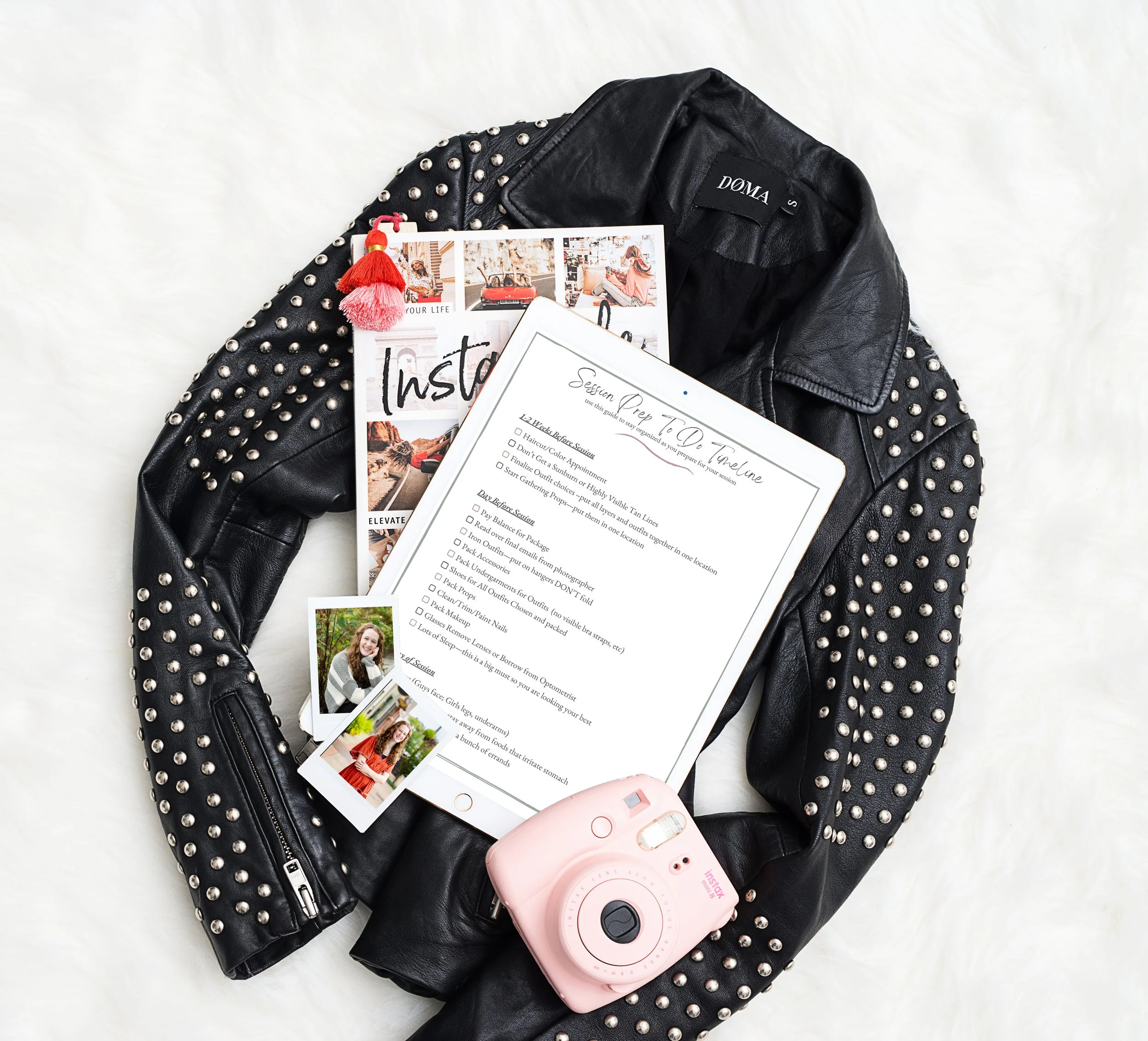 Flat lay mockup of a senior portrait session checklist displayed on a tablet with a studded leather jacket, instant camera, and printed senior photos, styled for a senior girl photo session.