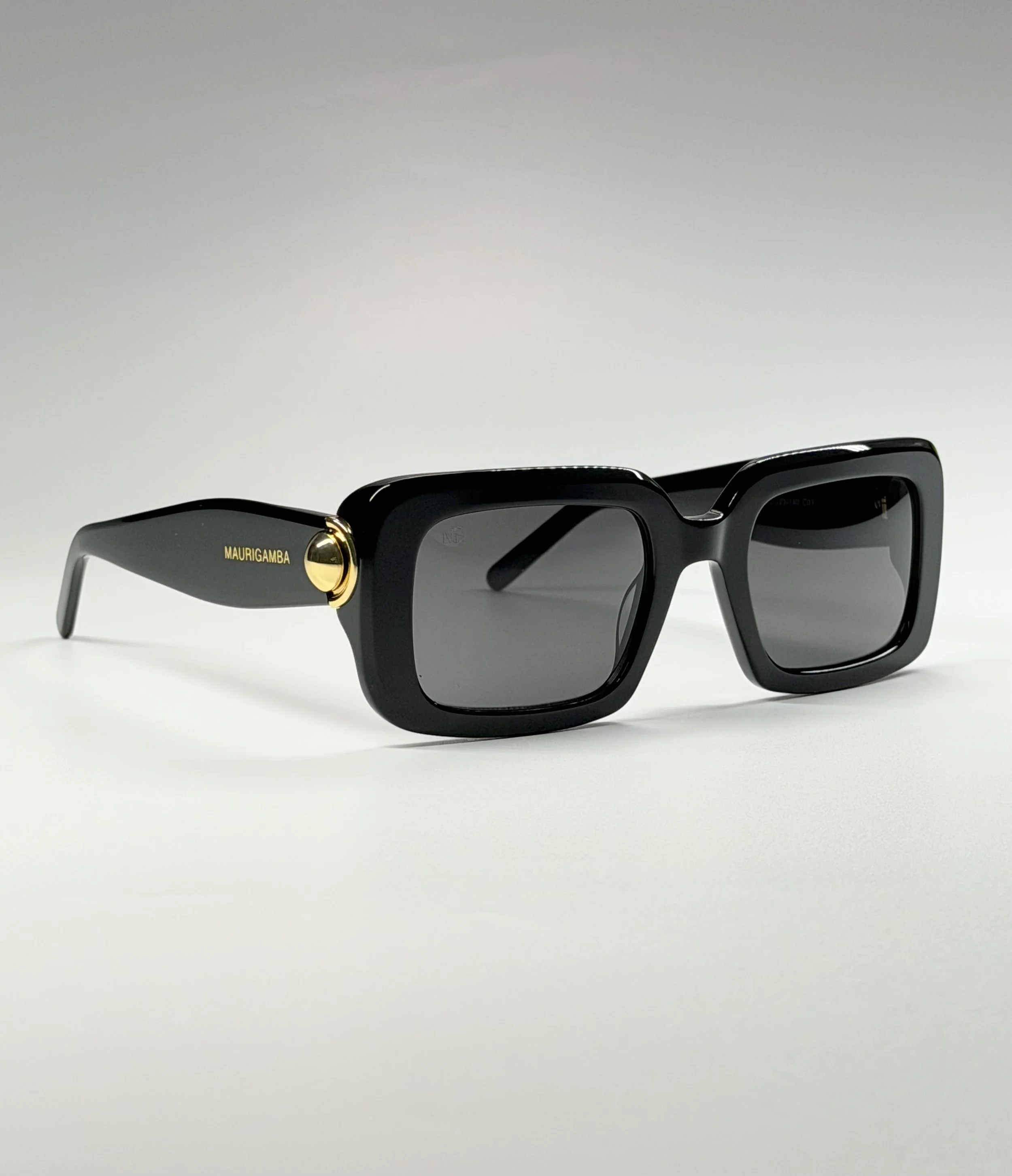 Sculpted Acetate Temples · Signature Gold Hardware · Contemporary Glamour