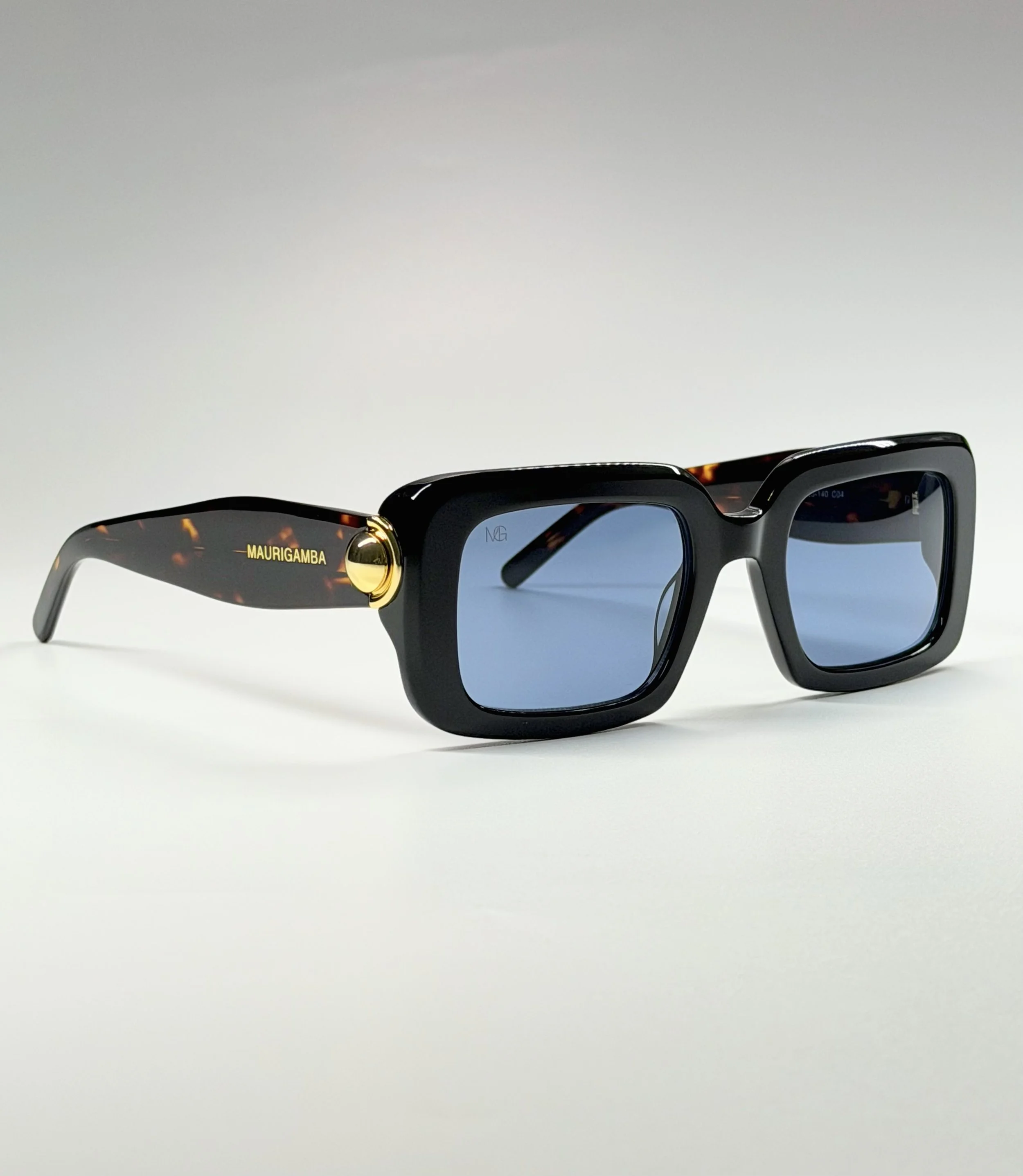 Tortoise Acetate Temples · Sculpted Oversized Shape · Signature Gold Hardware