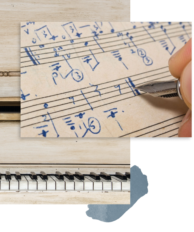 Close-up of someone writing musical notation on sheet music with a blue pen, showing handwritten notes and symbols.