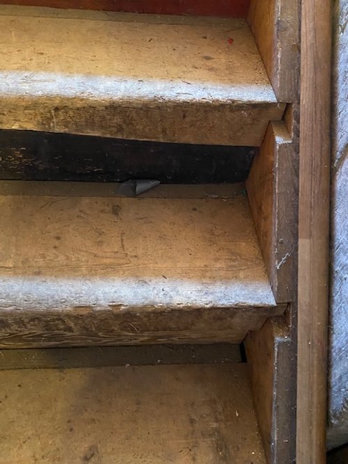 Hand cut and notched risers for building of the stairs to the basement.