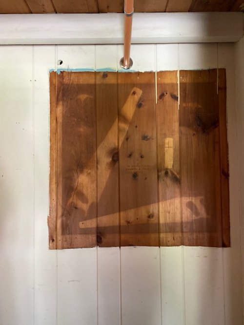 Wall in the log cabin house where the tools used by Edward Fenton Wood Jr. were previously displayed as a tribute to his excellent work. This wall will now house the newly created wooden memorial with tools.