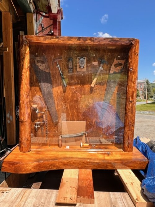 A "Cedar Memorial" built by hand by his son Edward Fenton Wood III houses the tools of the carpenter's trade at that time. It also contains a Black granite photo memorial to his father, Edward Fenton Wood Jr and his brother, Paul Jasper Wood.