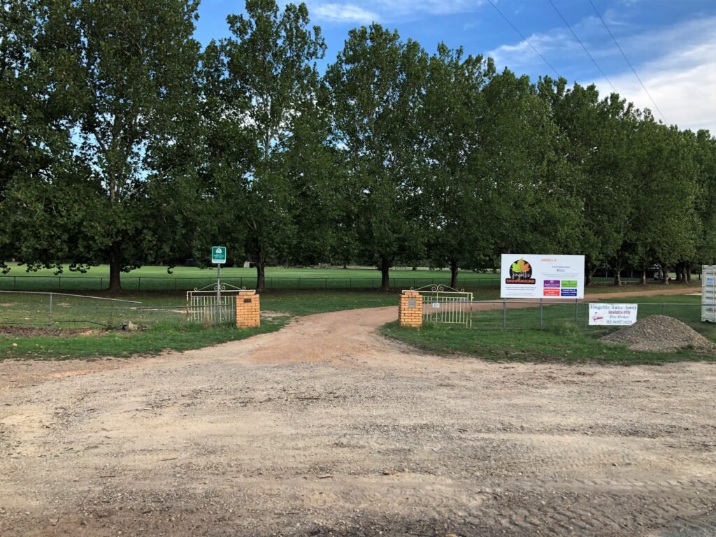  The current entrance to Jingellic Showgrounds. We propose to install a stunning rock entrance built from rocks eroded from the fire-damaged flanks of Mt Burrowa with artistic metal relief-style gates. 