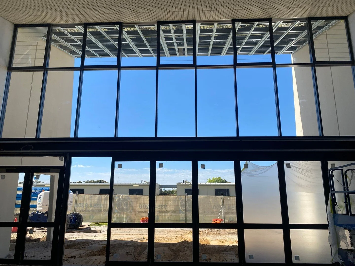 Floor-to-ceiling windows and doors have completely transformed the foyer of the Carey Baptist College stage c build. The natural light floods the space creating a bright, and welcoming atmosphere from the moment you walk in. ✨⁠
⁠
#ClassicContractors 