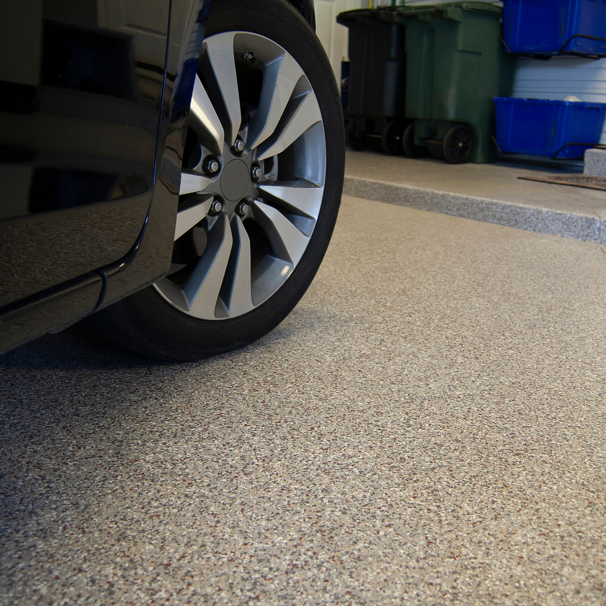 an epoxy coated garage floor with textured flakes.