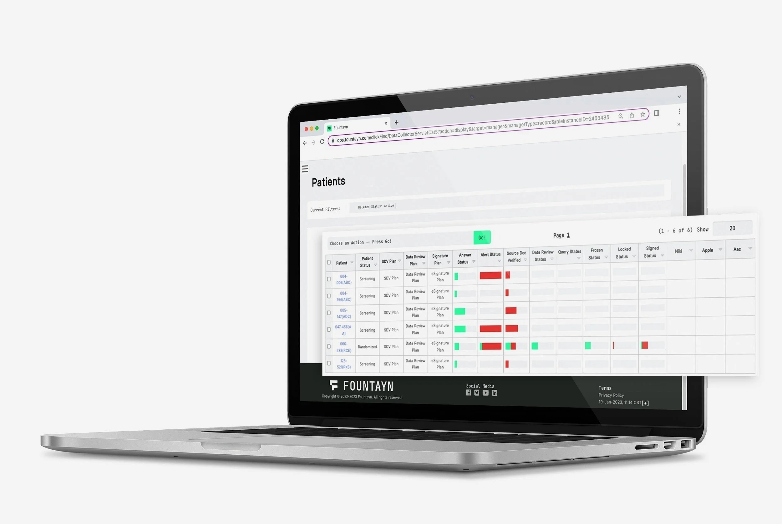 Laptop displaying a medical data dashboard with patient information, charts, and status indicators.