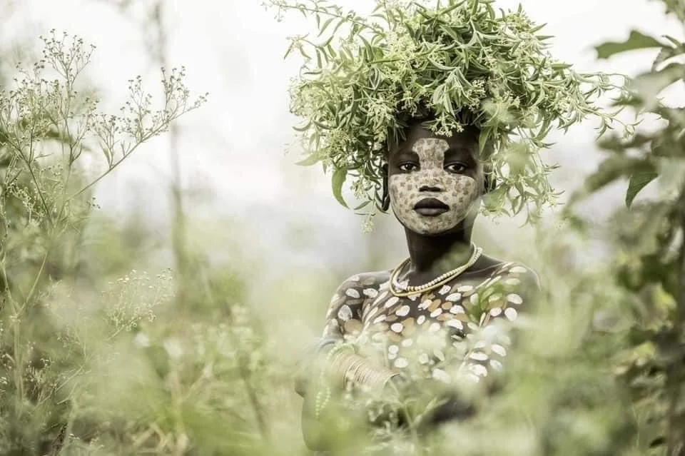 African woman with hair of leaves
