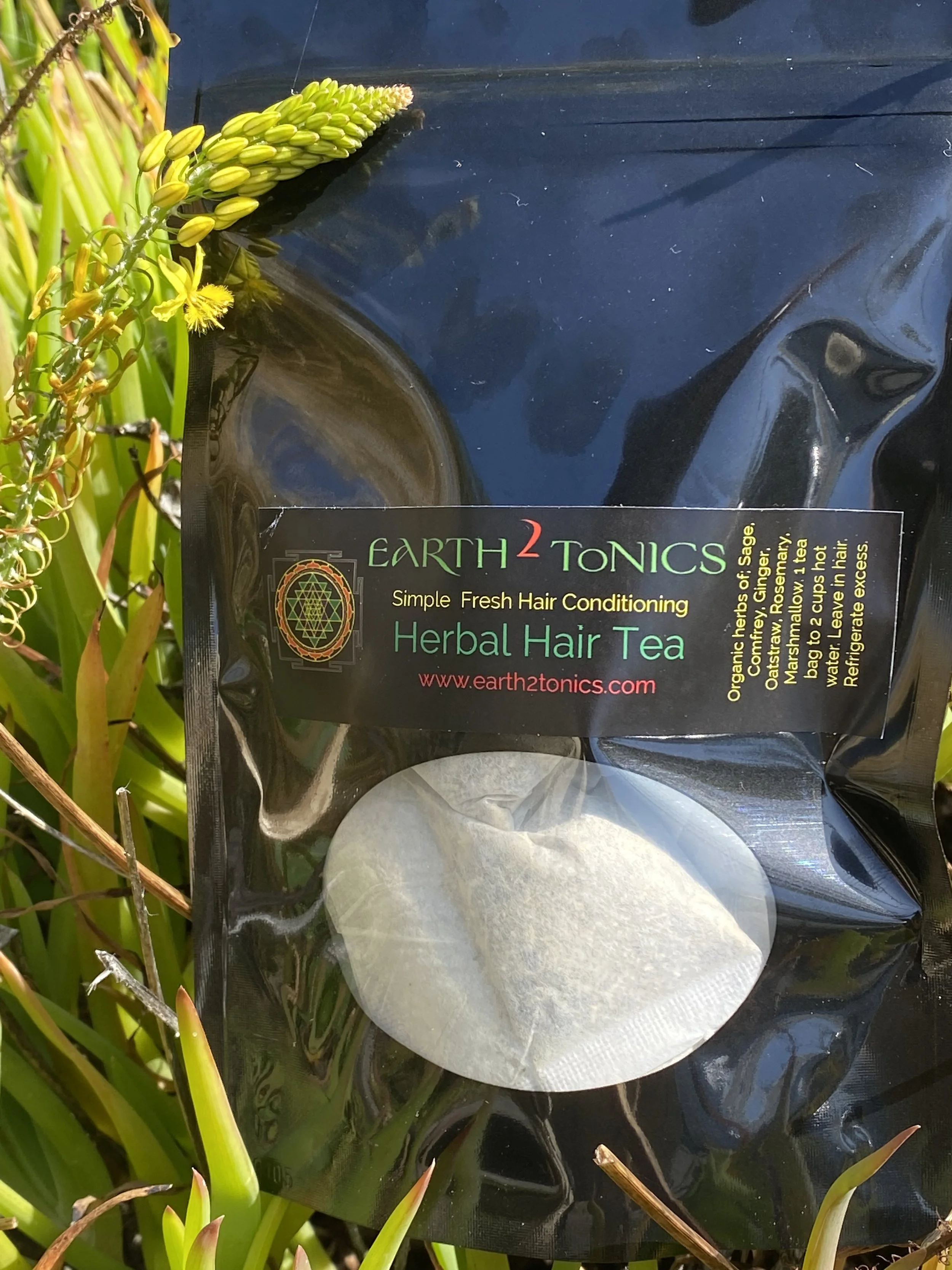 “Herbal Hair Tea in black pouch – organic tea blend for hair growth, scalp nourishment, and overall hair wellness. Supports healthy, strong, and shiny hair naturally.”