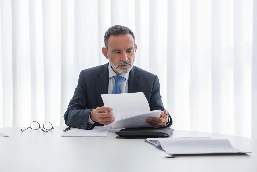 Executive reviewing reports