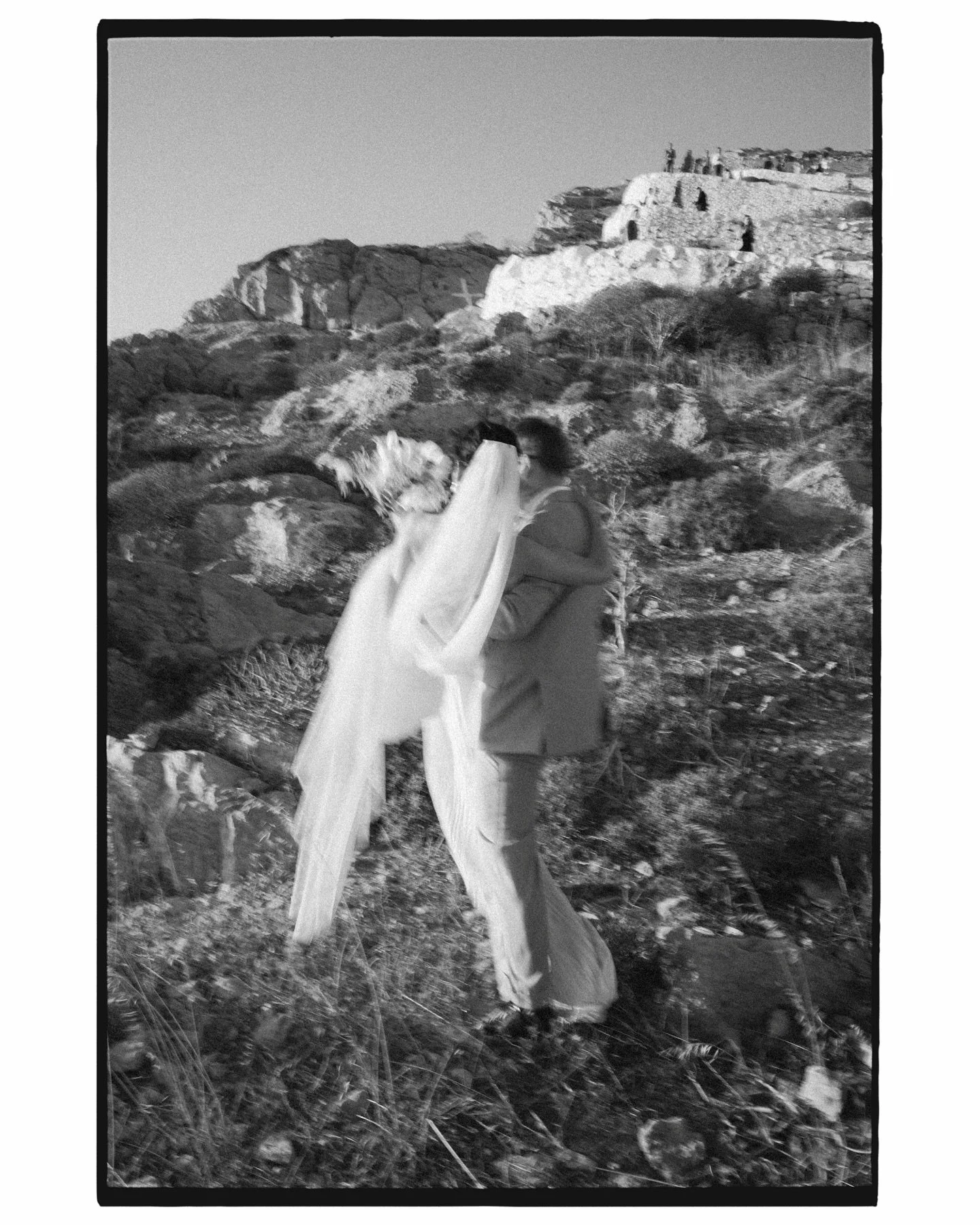 One of my favourite images from this year from Tim &amp; Melina&rsquo;s gorgeous Greek Island wedding. 
Tim picked up Melina to help her down the most incredible  hill from their ceremony, guests following in the background. The second image shows qu