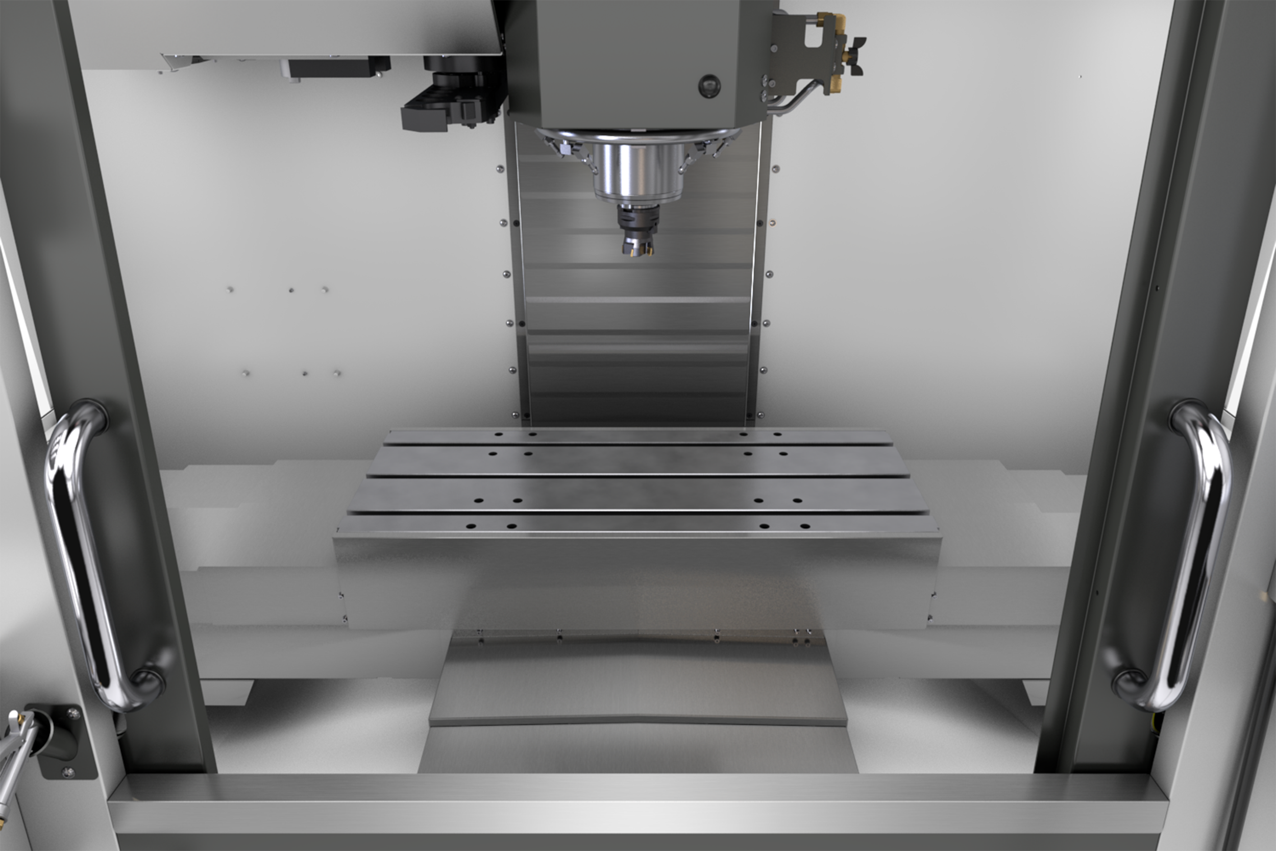 View inside a CNC machine focusing on the metal worktable and spindle.