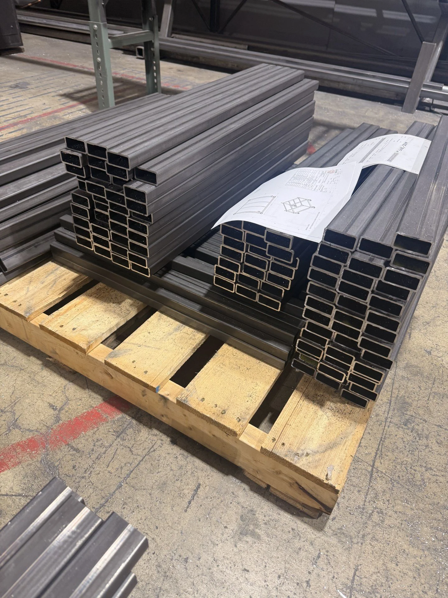 Stacks of precision saw cut steel tubes.