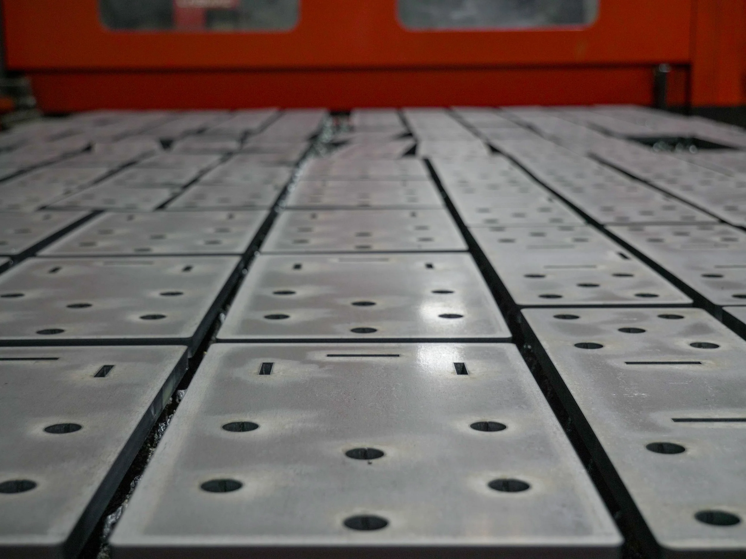 Precision, custom fiber laser cut metal parts with clean edges and tight tolerances in Portland, Oregon.