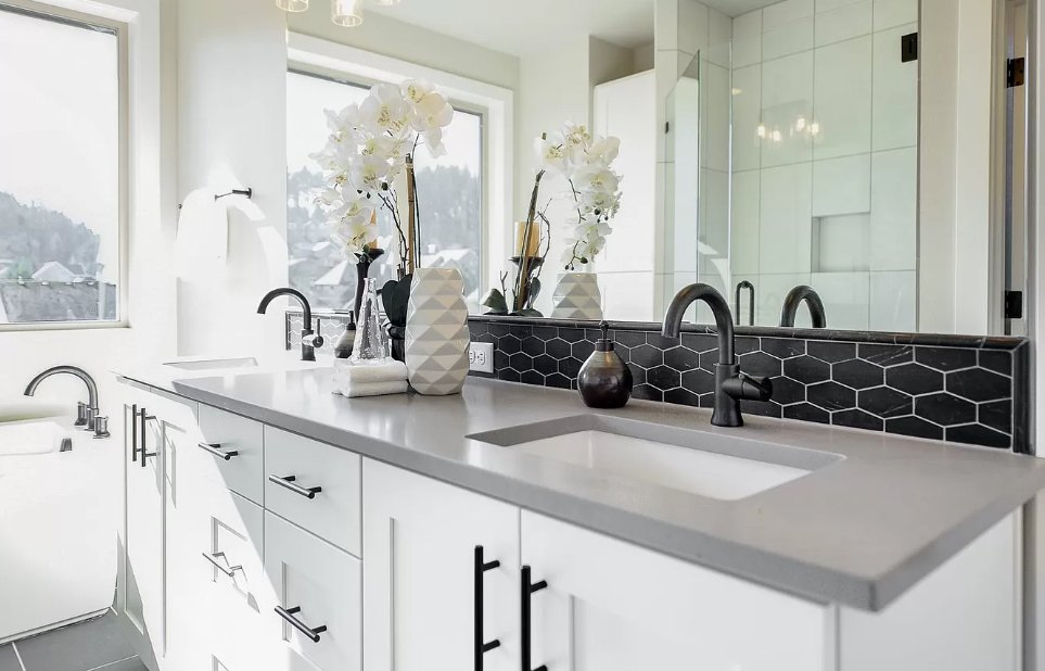 A double vanity with dark accents — Stillwater Lane.