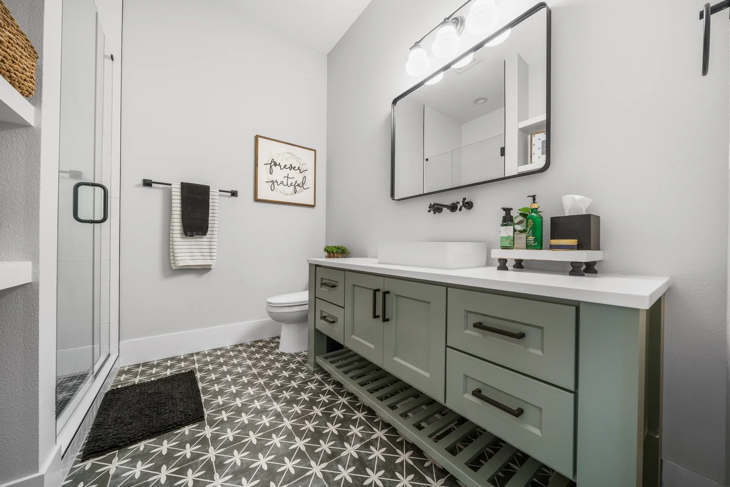 A bathroom with custom cabinetry — Generations at Meridian.