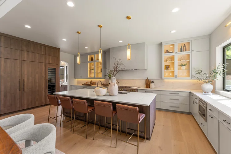 The Atelier’s kitchen with natural wood cabinetry and a large island