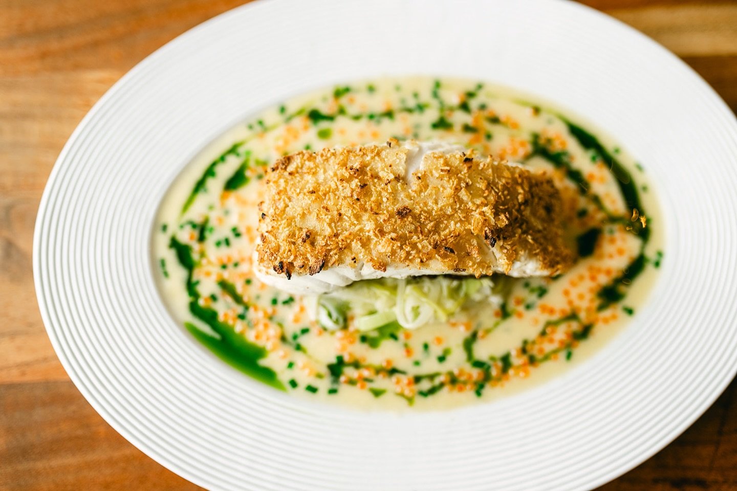 Golden Potato-Crusted Halibut 🤍

Crisp on the outside, tender and flaky within&mdash;served with buttered leeks and rich caviar cream.

Join us for a truly special bite.

#lucastonybrook